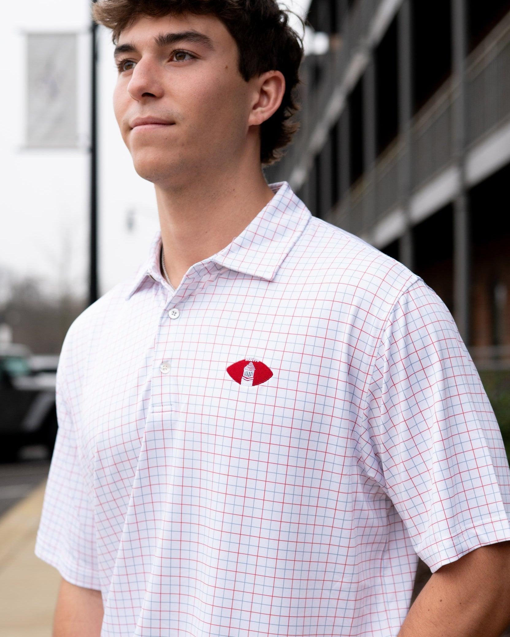University of Alabama Red/Blue/White patterned Men’s Polo with Denney Chimes in a football embroidered on the chest
