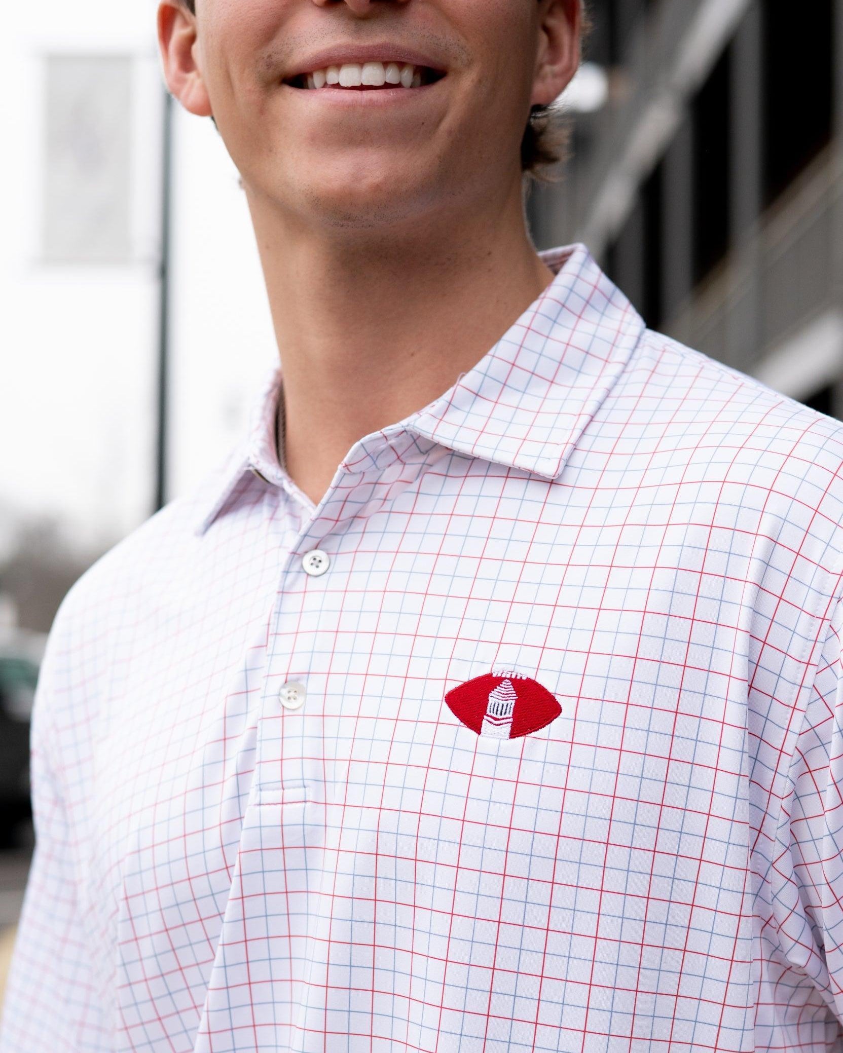 University of Alabama Red/Blue/White patterned Men’s Polo with Denney Chimes in a football embroidered on the chest