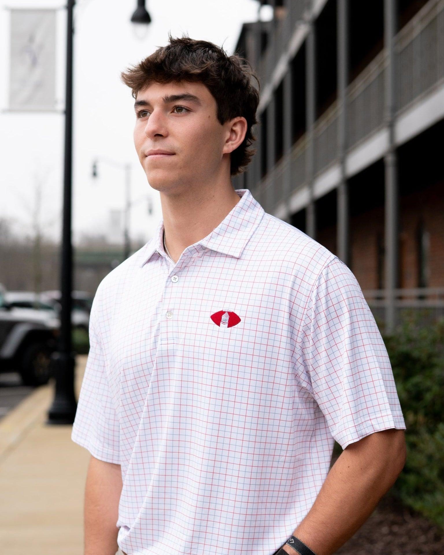 University of Alabama Red/Blue/White patterned Men’s Polo with Denney Chimes in a football embroidered on the chest