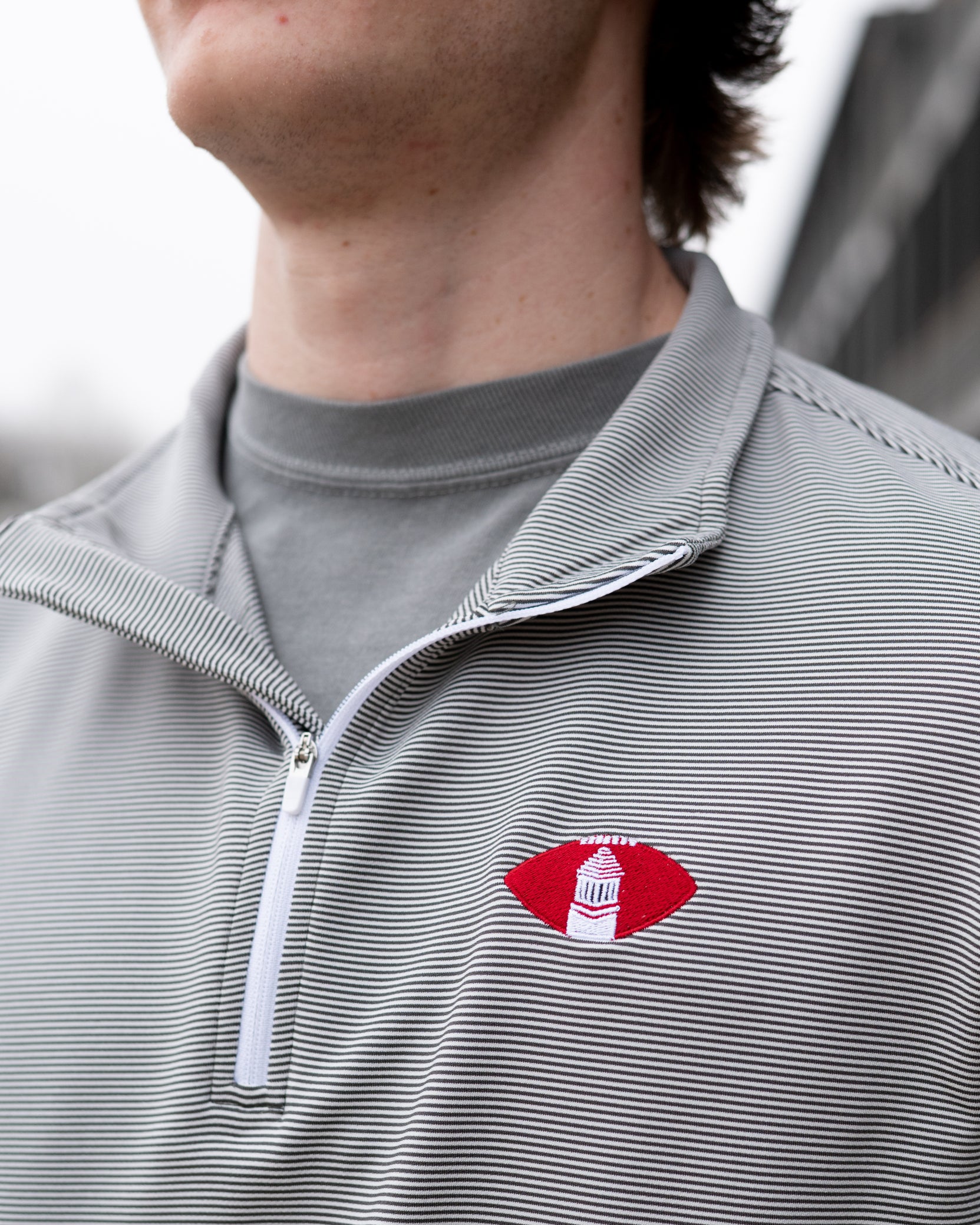 University of Alabama Grey Striped Men’s ¼ Zip Pullover with Denney Chimes in a football embroidered on the chest