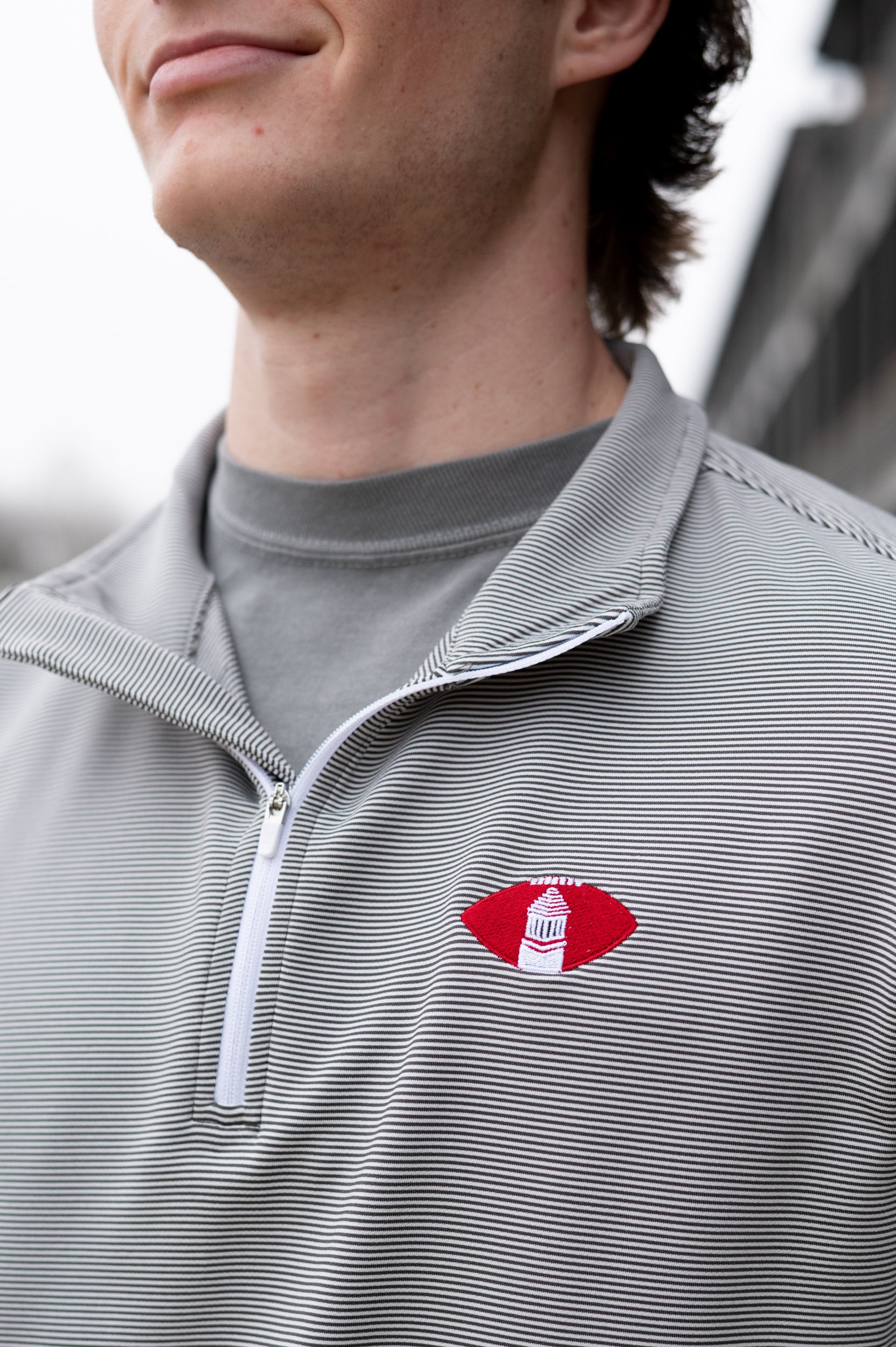 University of Alabama Grey Striped Men’s ¼ Zip Pullover with Denney Chimes in a football embroidered on the chest