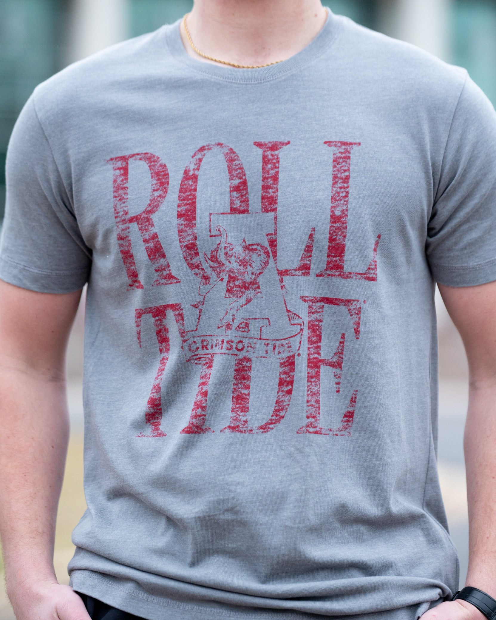 University of Alabama Grey T-Shirt with a distressed print of the Vintage A logo in front of Red text “Roll Tide”