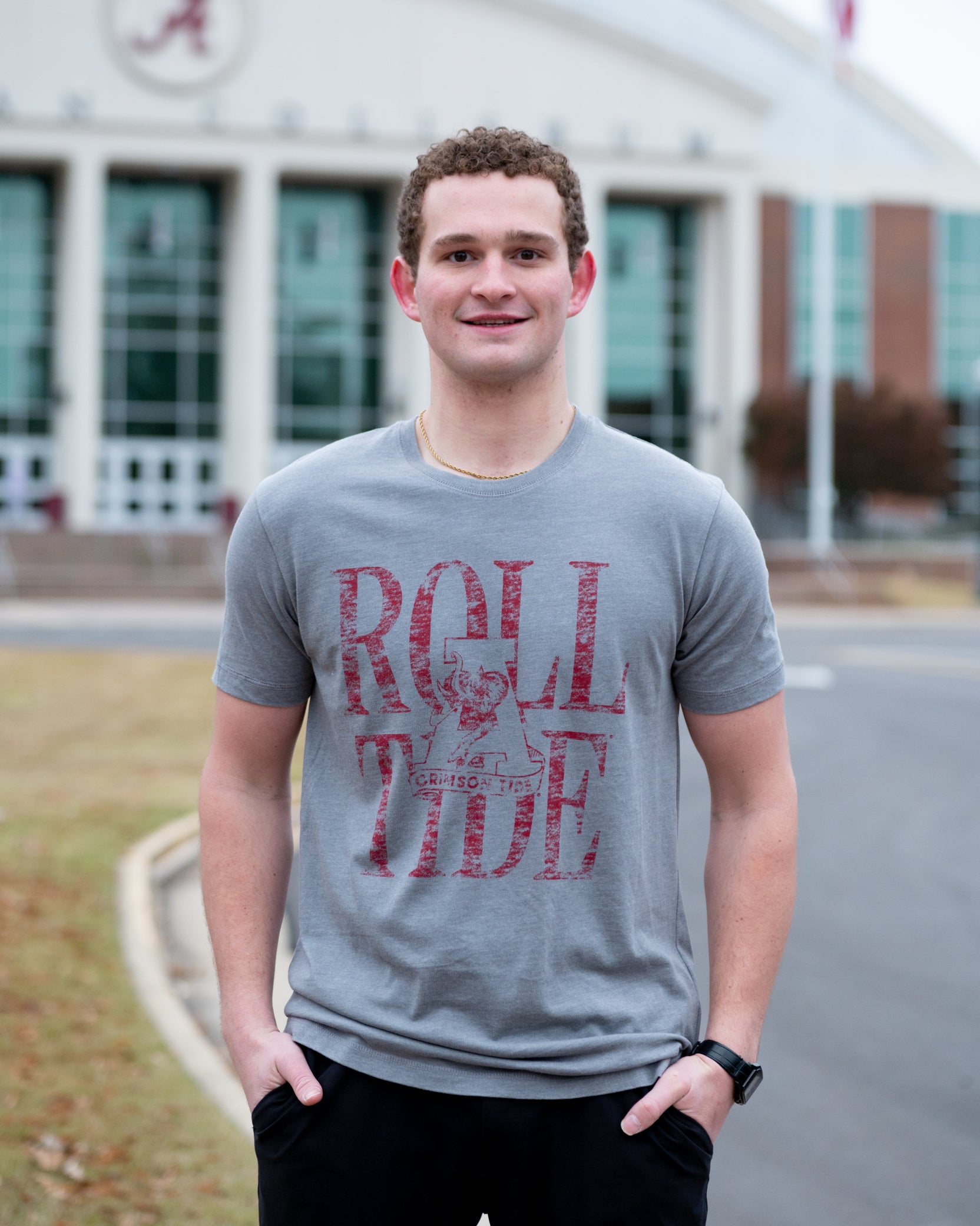 University of Alabama Grey T-Shirt with a distressed print of the Vintage A logo in front of Red text “Roll Tide”
