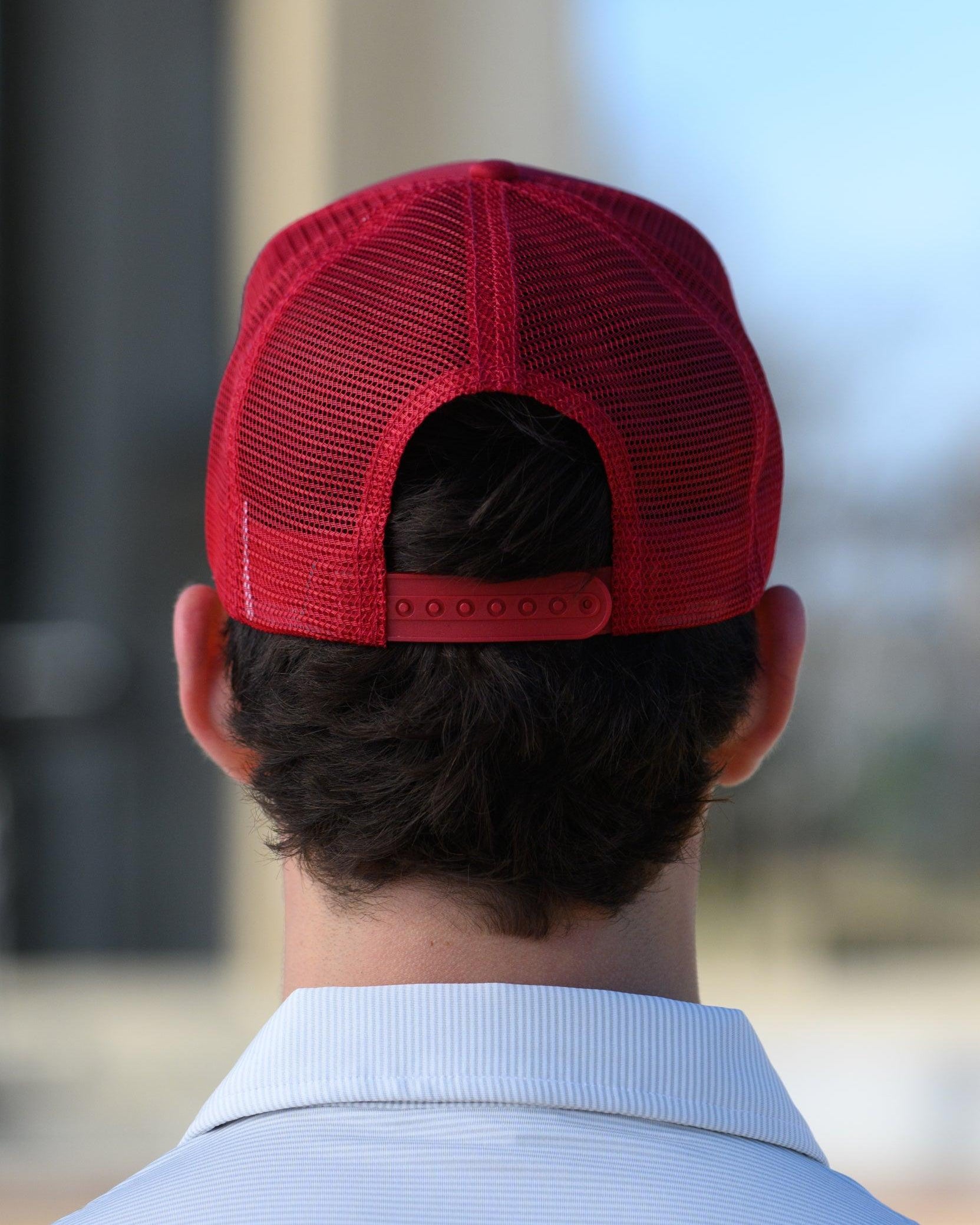 University of Alabama Red Trucker Hat with a patch featuring text “Dixieland” above and “Delight” below drawings of a cowboy boot, money, drink can, football, and playing card
snapback trucker