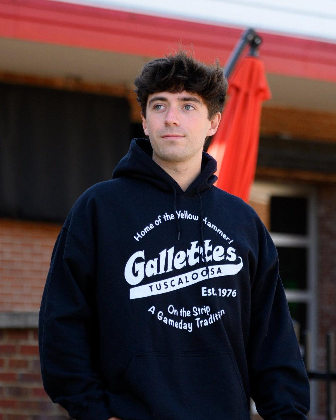 Gallettes Black Hoodie with a White Gallettes logo surrounded by White text "Home of the Yellow Hammer!" and "On the Strip- A Gameday Tradition"