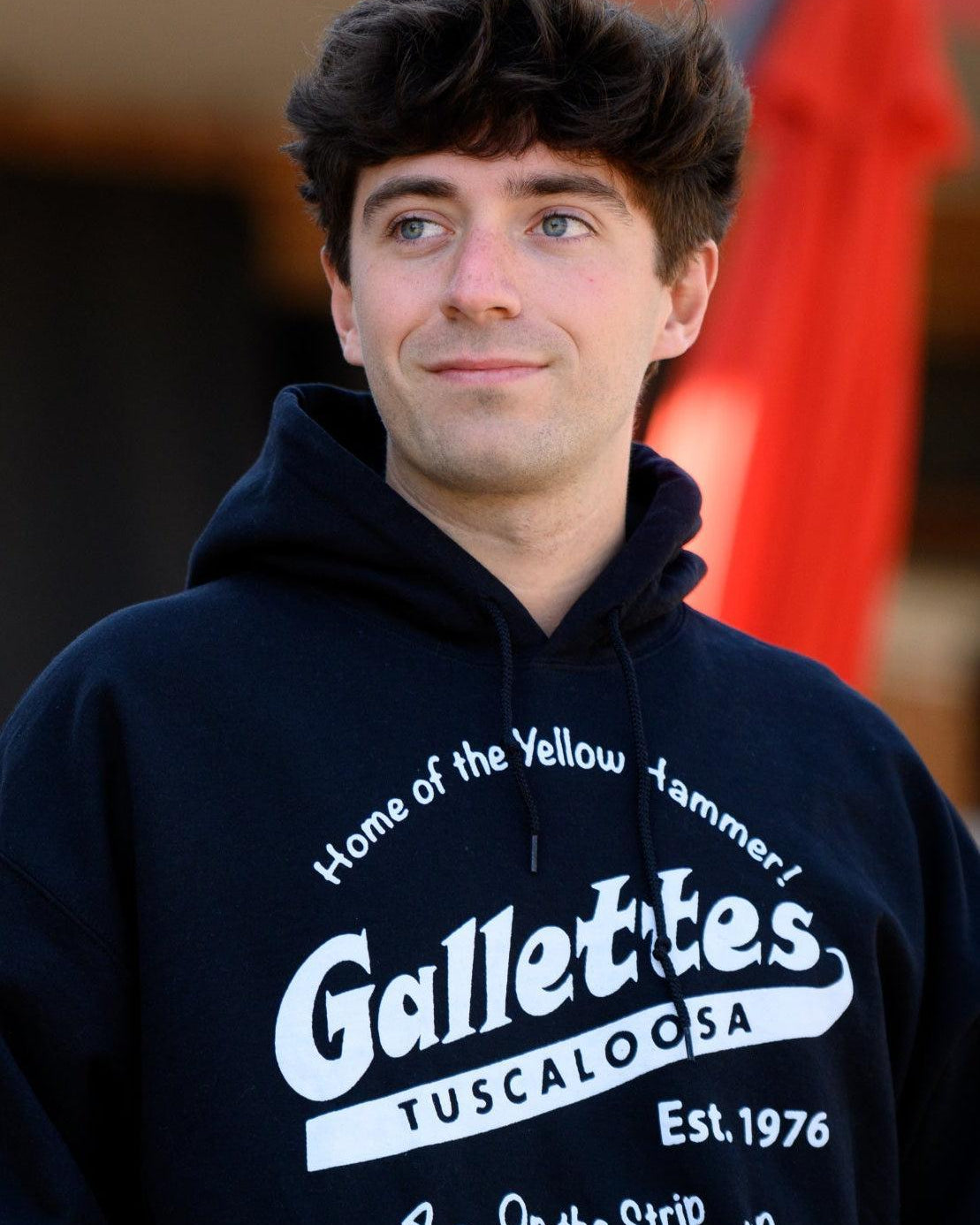 Gallettes Black Hoodie with a White Gallettes logo surrounded by White text "Home of the Yellow Hammer!" and "On the Strip- A Gameday Tradition"