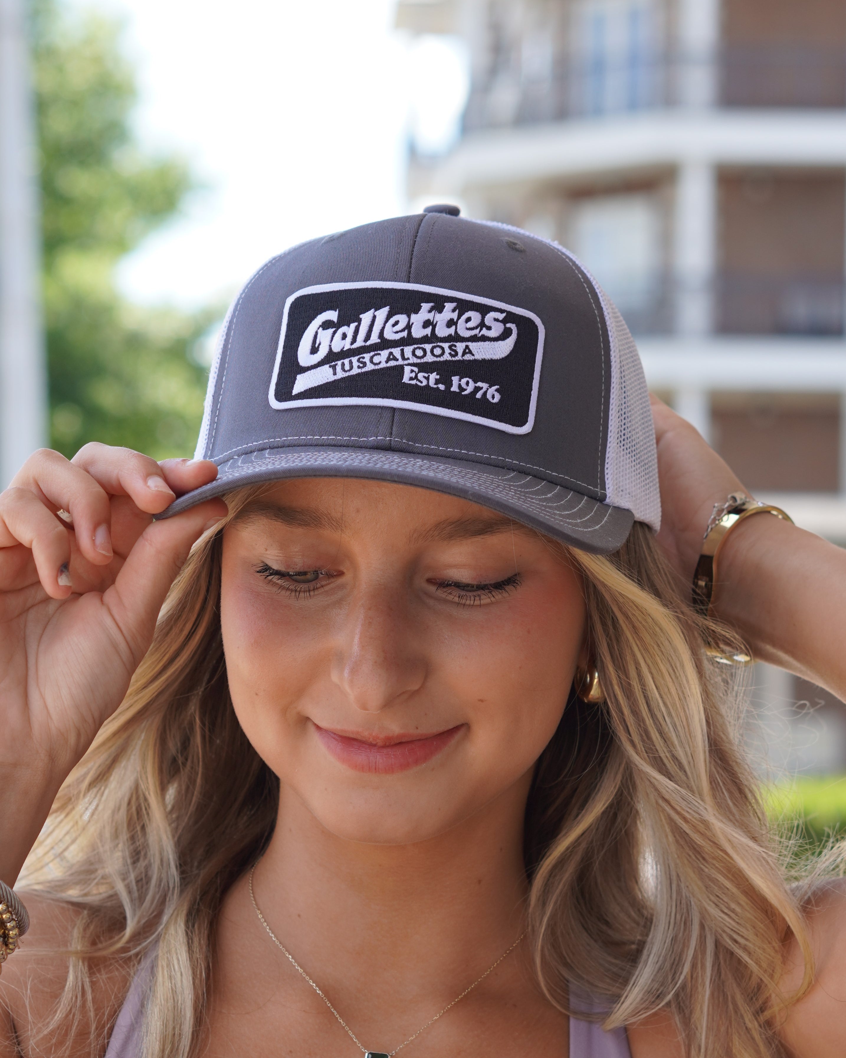 Gallettes Grey Trucker Hat with a Black Patch that features the Gallettes Logo in White embroidery