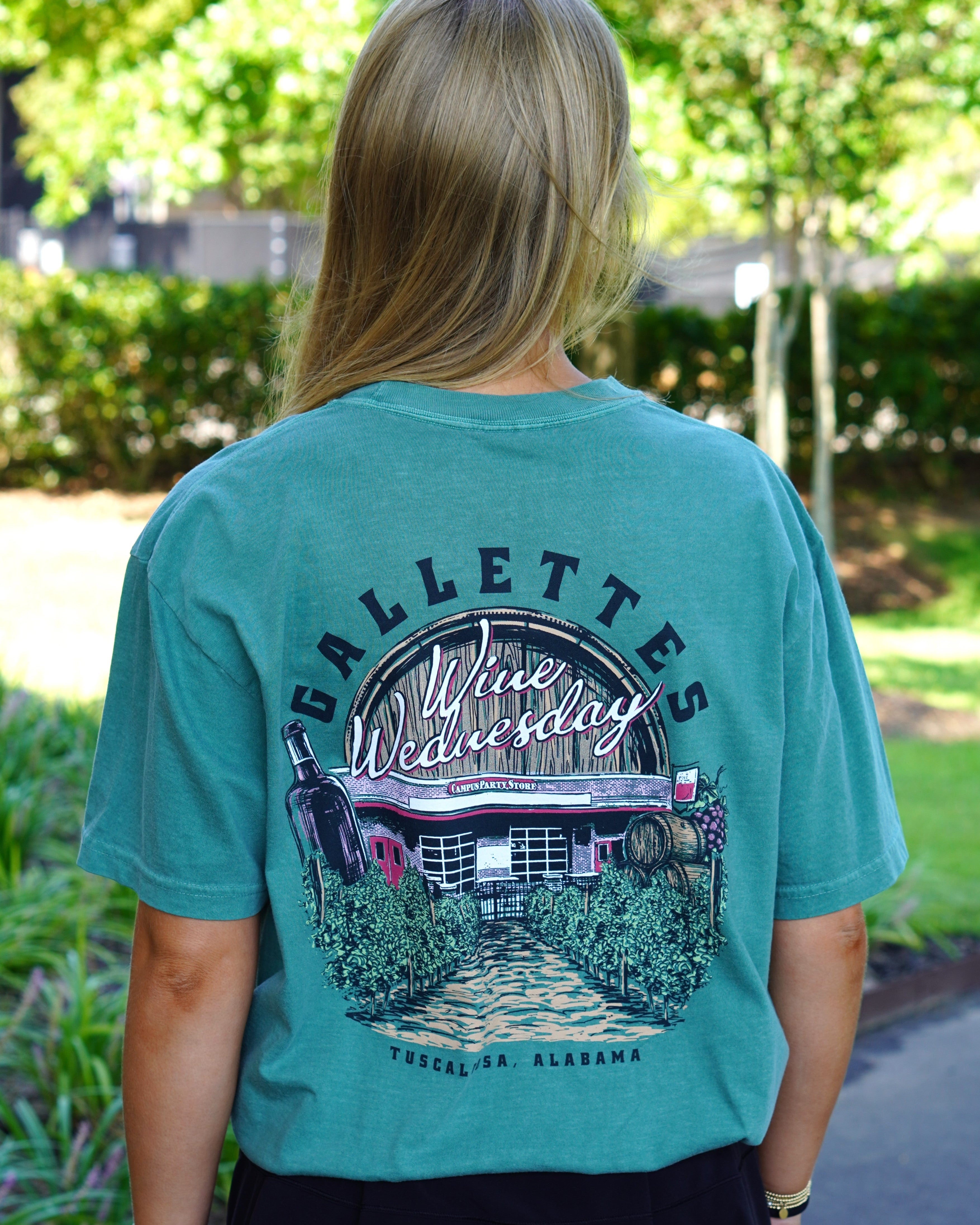 Gallettes Green Wine Wednesday T-Shirt with an image of the Gallettes Building in a vineyard in front of a wine barrel with White text "Wine Wednesday