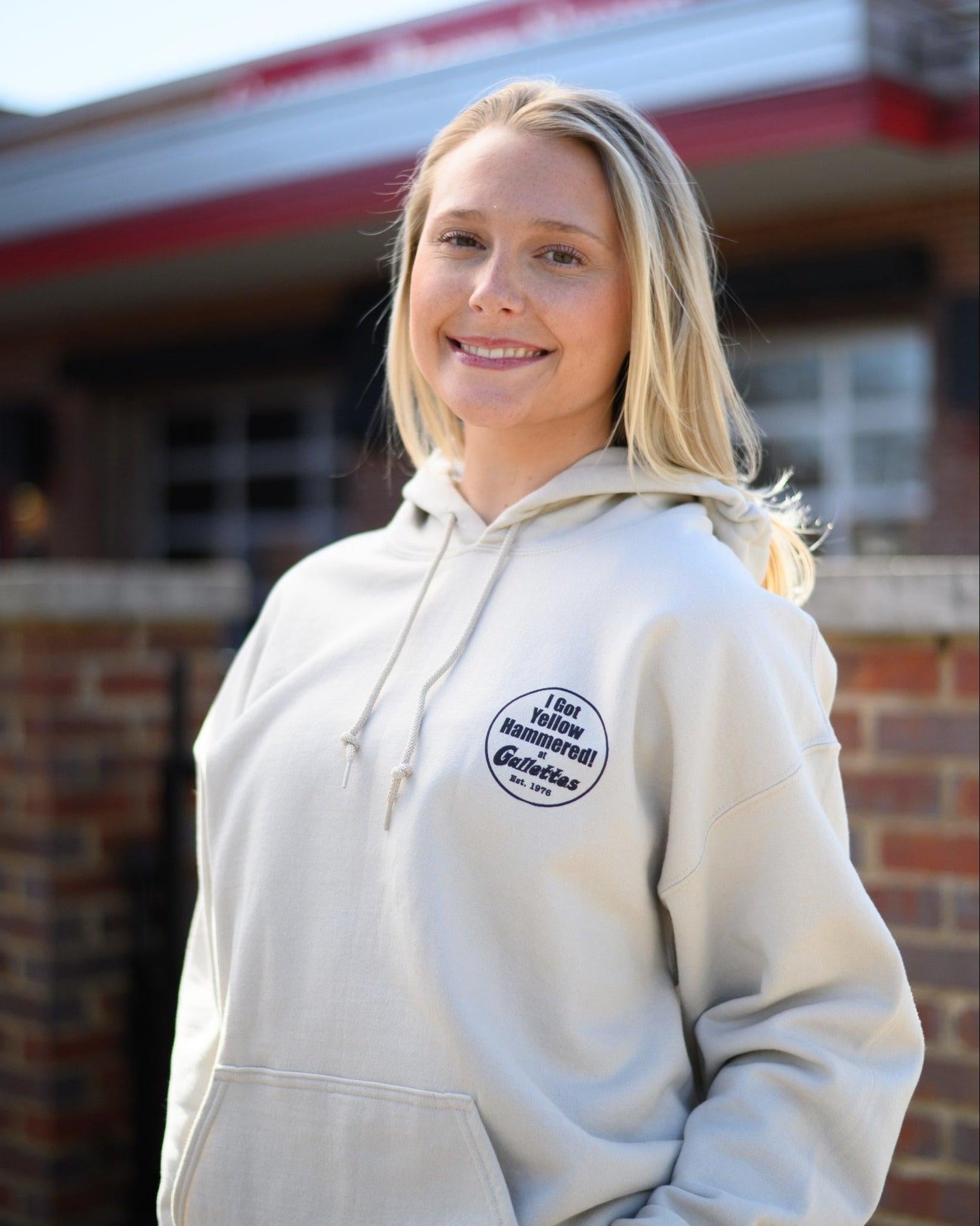 Gallettes Tan Hoodie with an “I Got Yellow Hammered at Gallettes” left chest design