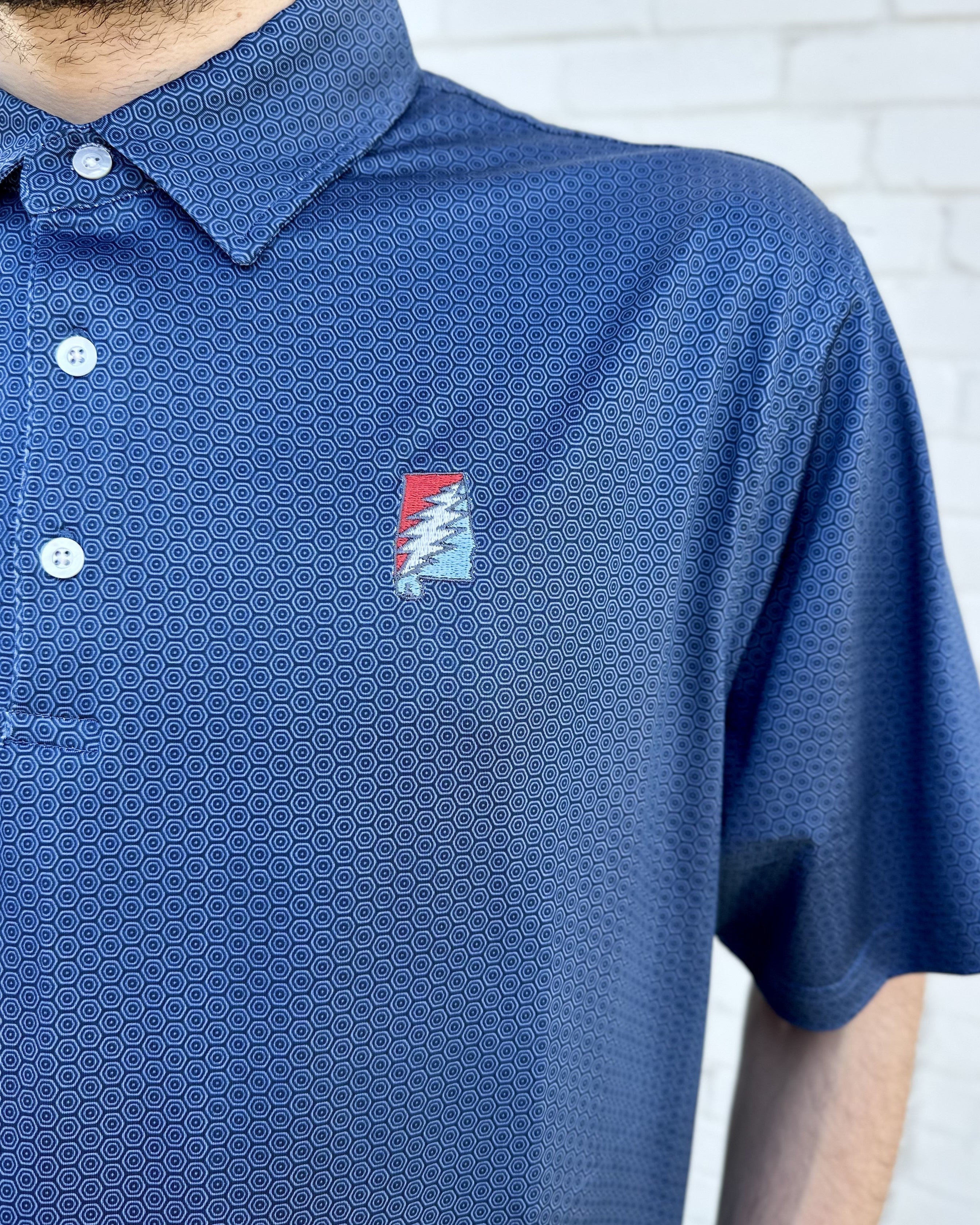 Grateful State Navy Men’s Hex Polo with Red and Blue embroidery of the Alabama "Grateful State" Logo