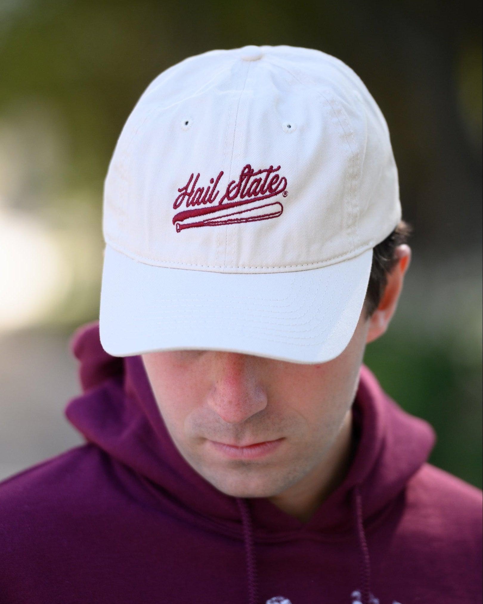 Mississippi State Light Tan Dad Hat with Maroon “Hail State” script and baseball bat embroidery