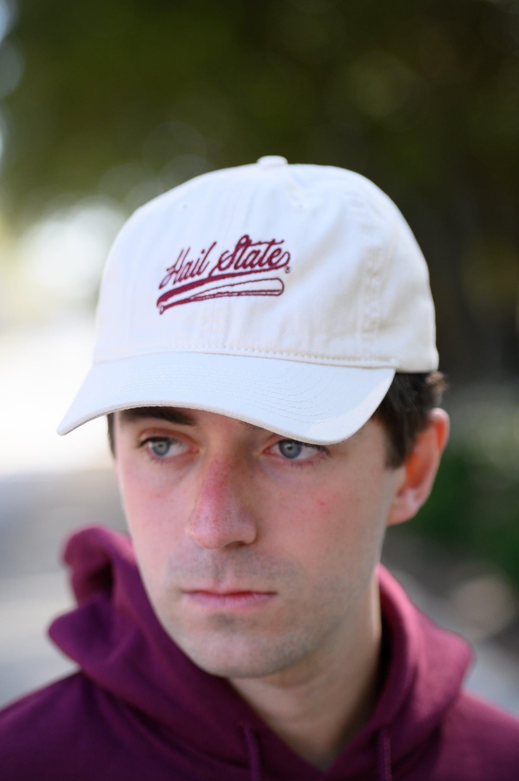 Mississippi State Light Tan Dad Hat with Maroon “Hail State” script and baseball bat embroidery