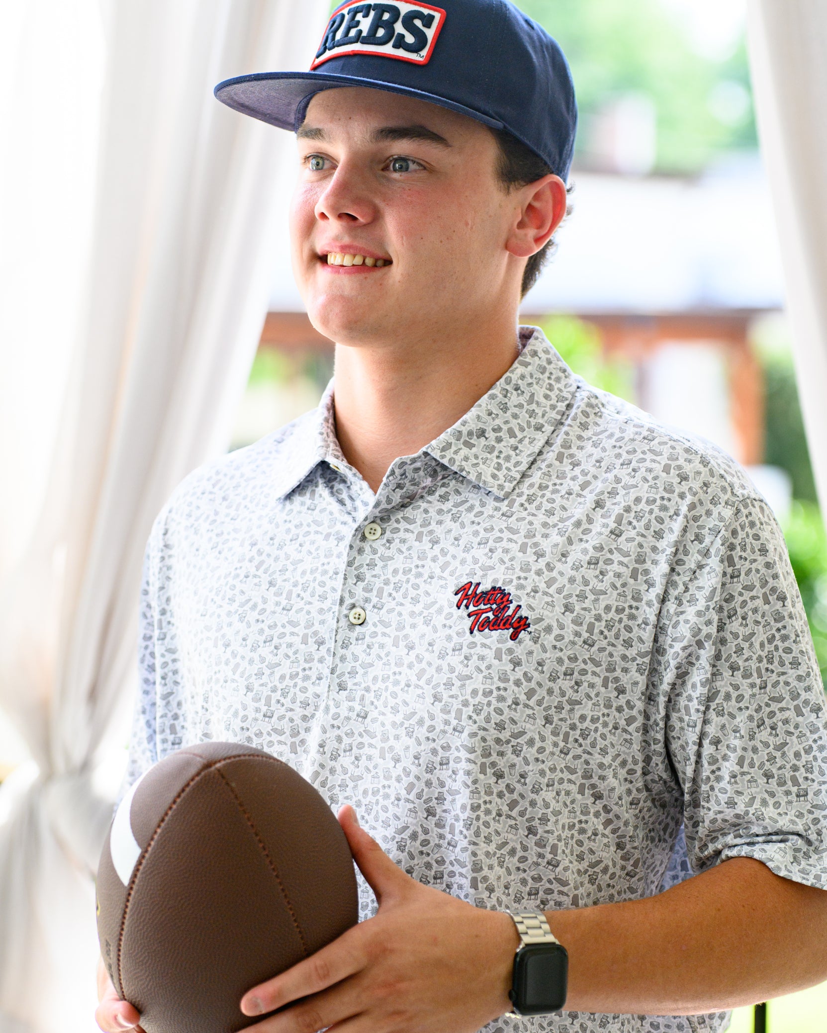 Ole Miss Grey Men’s Patterned Polo with a tailgate themed pattern and Red script “Hotty Toddy” embroidery
