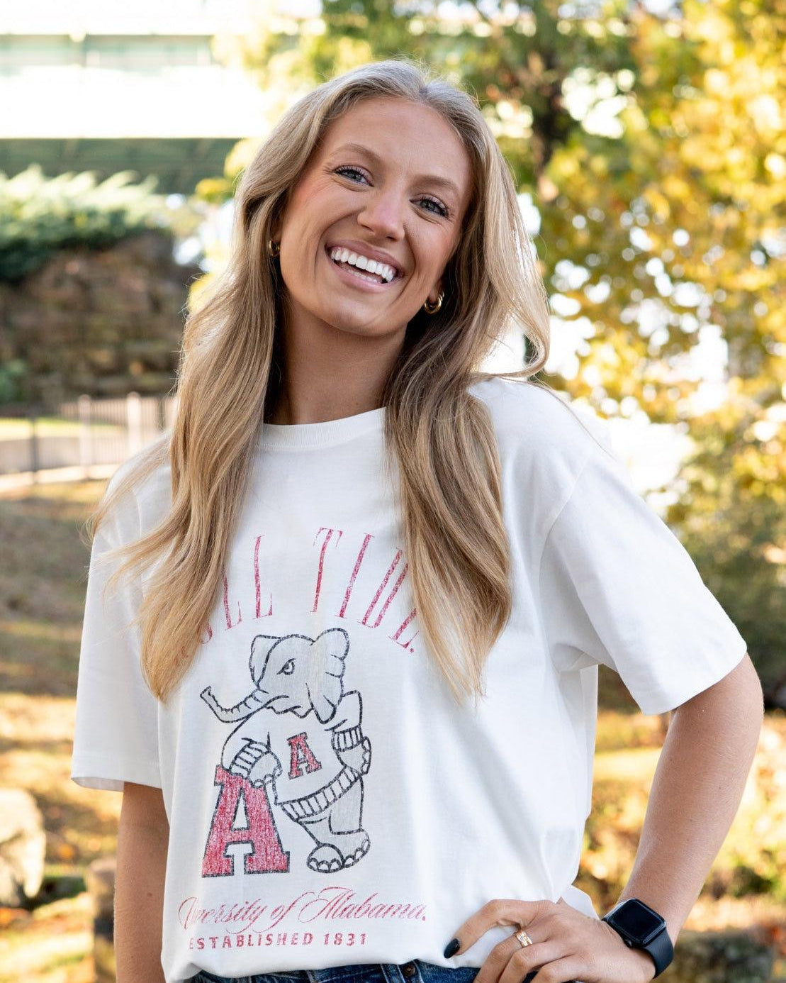 University of Alabama Ivory T-Shirt with Red text “Roll Tide” above an image of Big Al leaning on a Black A