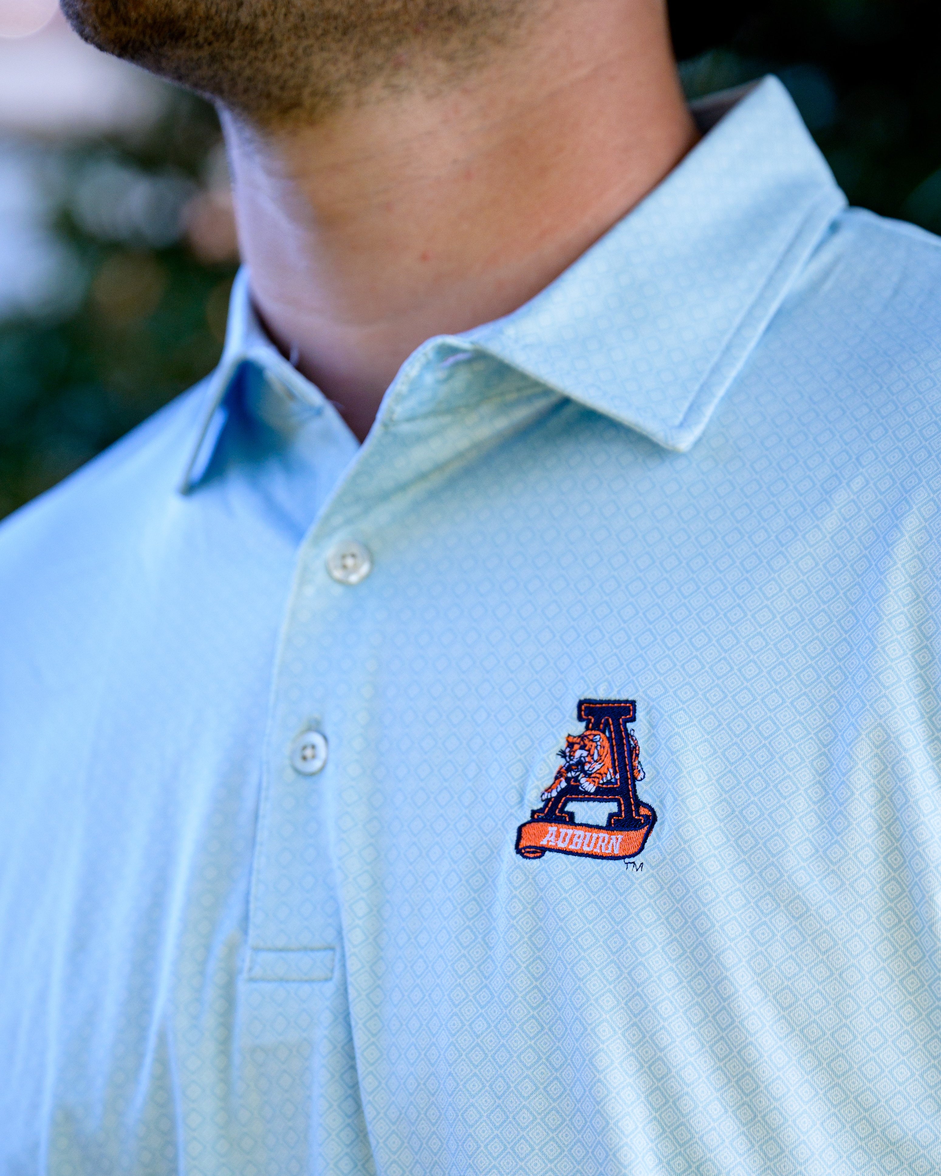 Auburn University Light Blue Diamond Polo with embroidery of Aubie leaping through an "A"