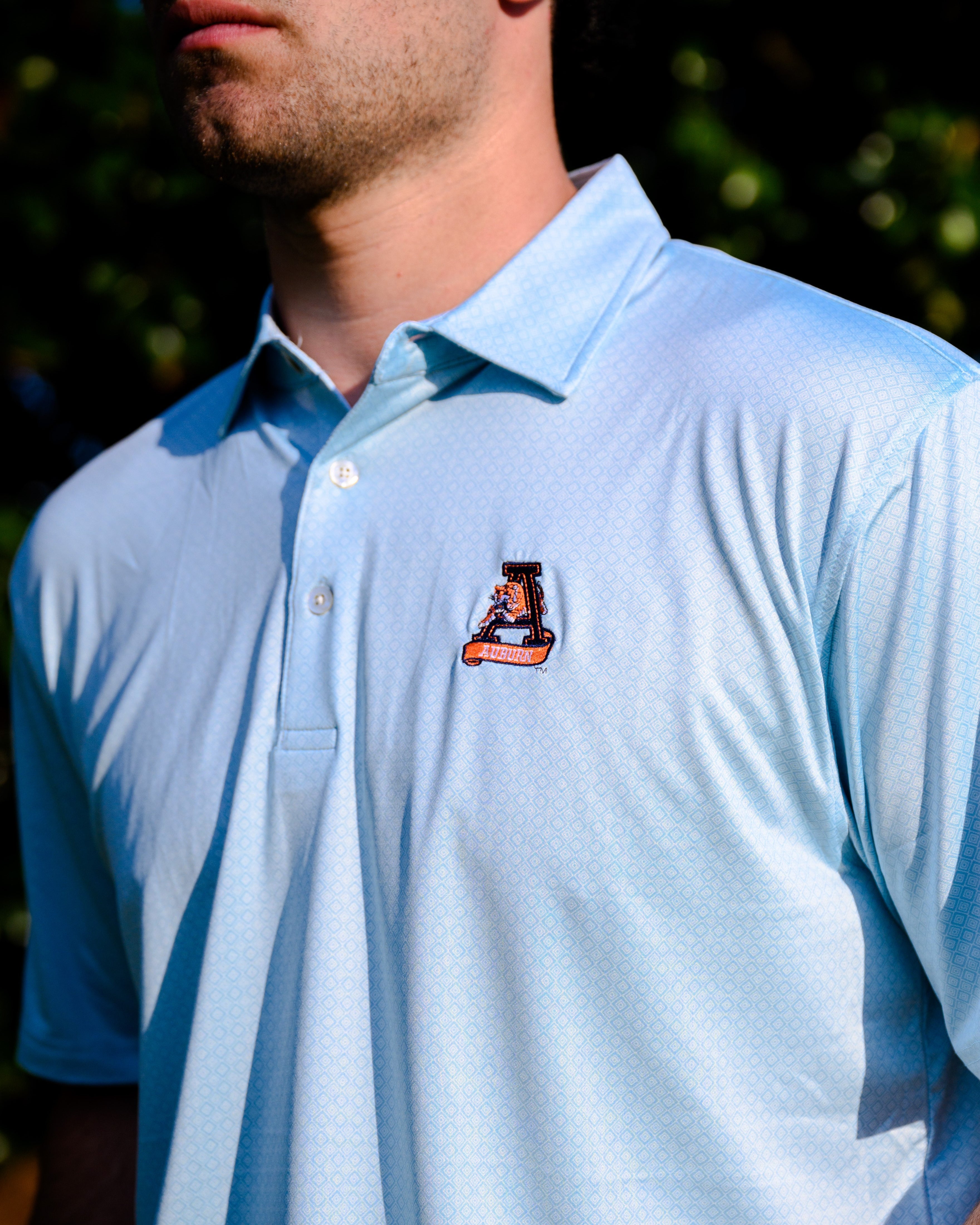 Auburn University Light Blue Diamond Polo with embroidery of Aubie leaping through an "A"