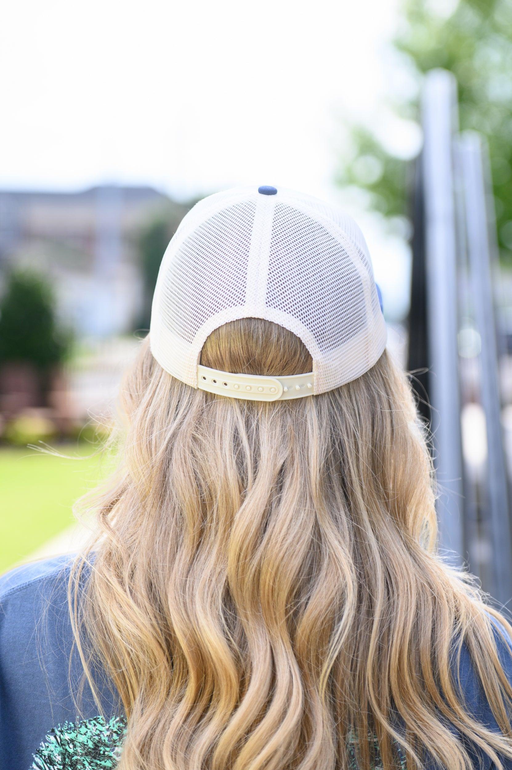 Auburn University White and Navy Hat with embroidery of Aubie leaping through an "A"