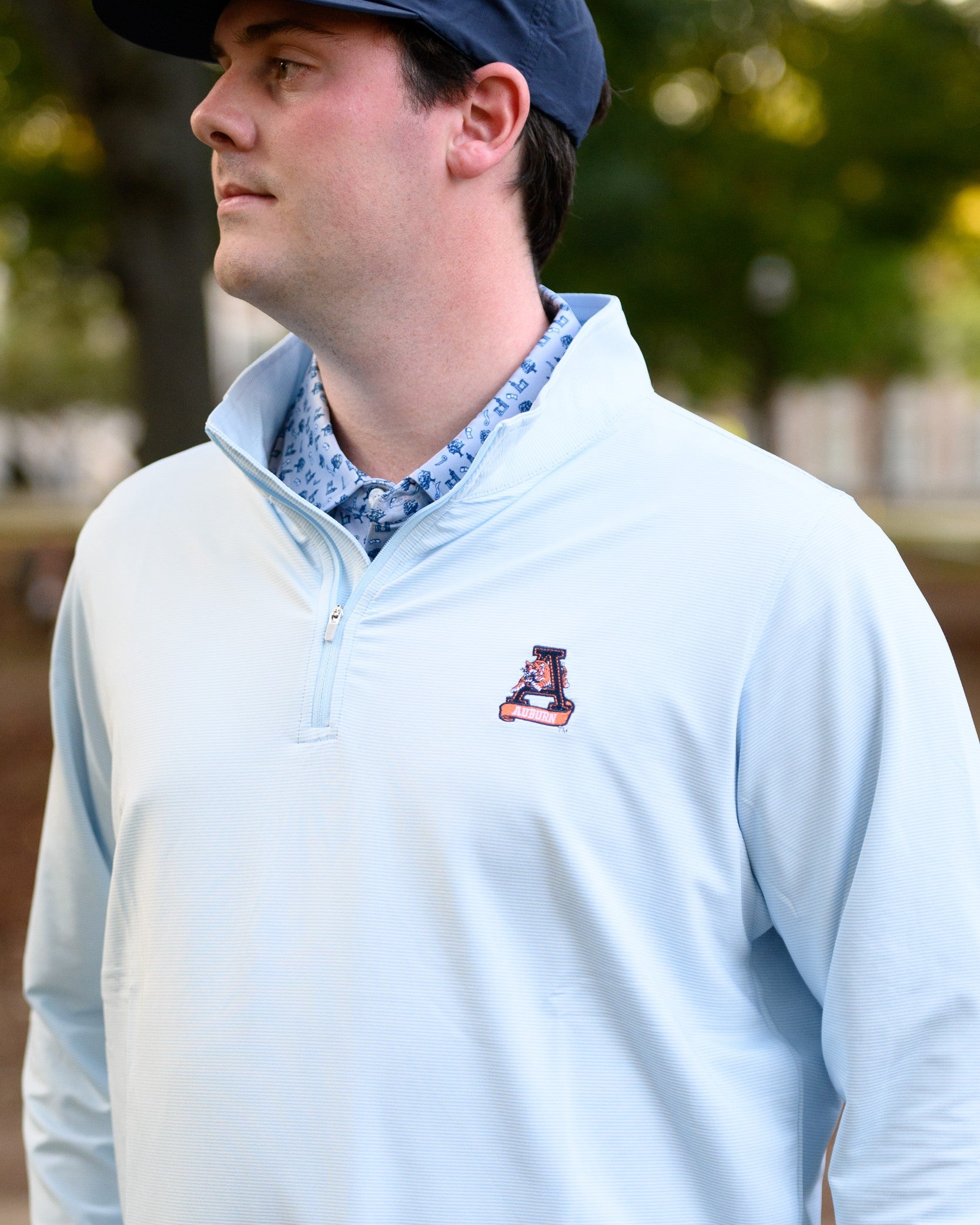 Auburn University Light Blue Men’s ¼ Zip with embroidery of Aubie leaping through an "A"