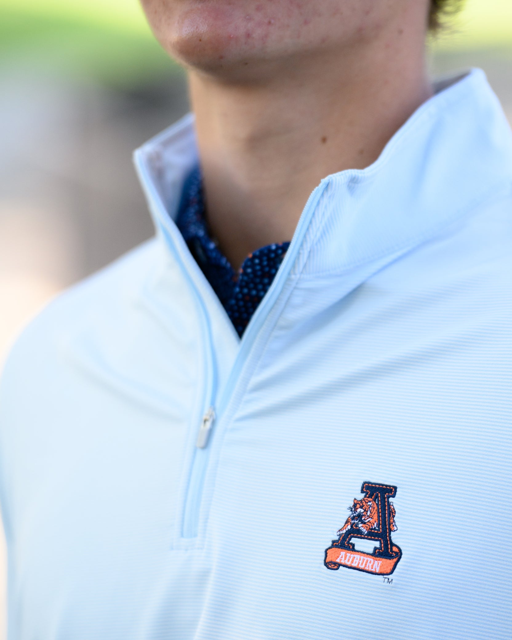 Auburn University Light Blue Men’s ¼ Zip with embroidery of Aubie leaping through an "A"