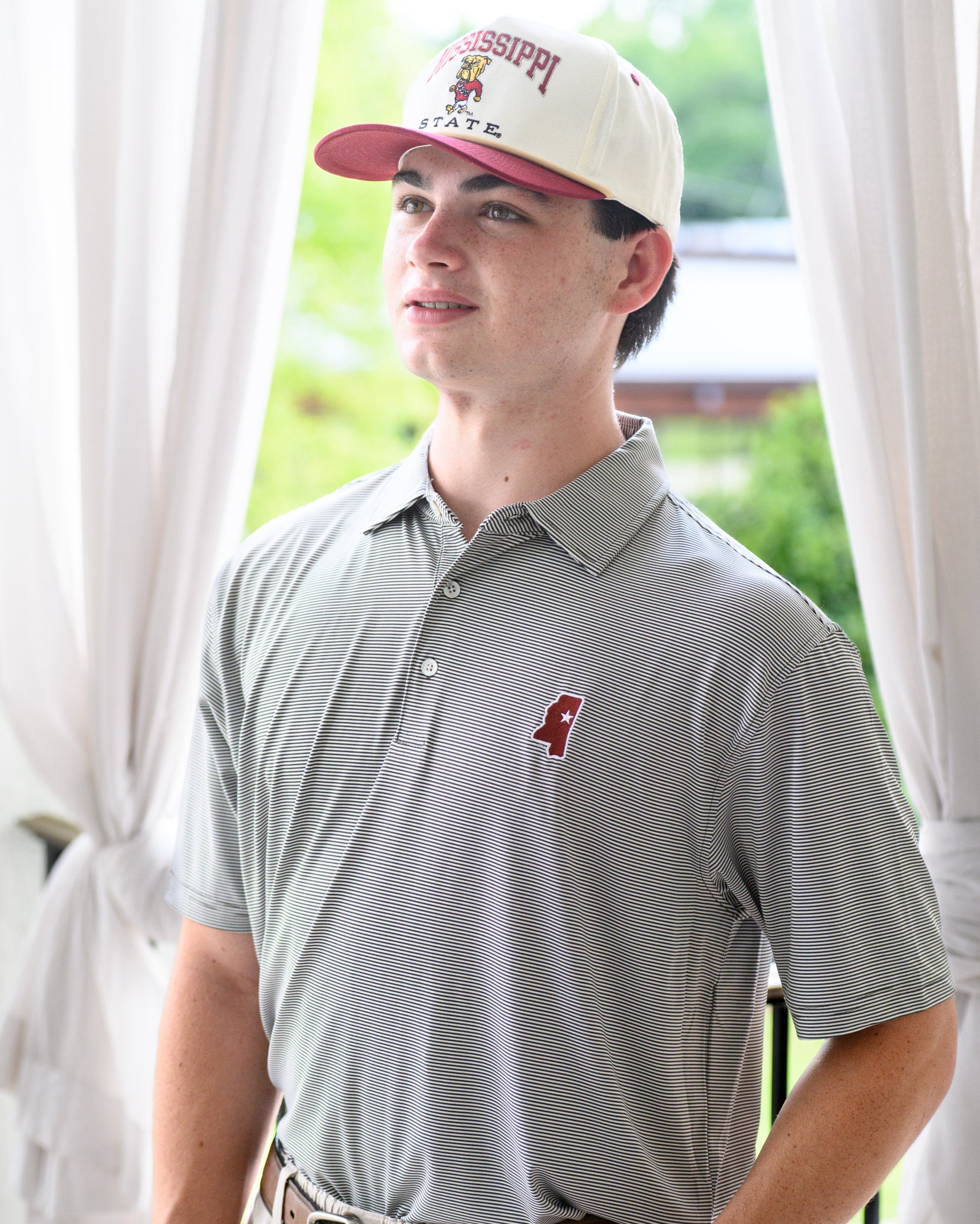 Mississippi State Cream and Maroon Hat with the Walking Bully Logo in between embroidered text “Mississippi State”