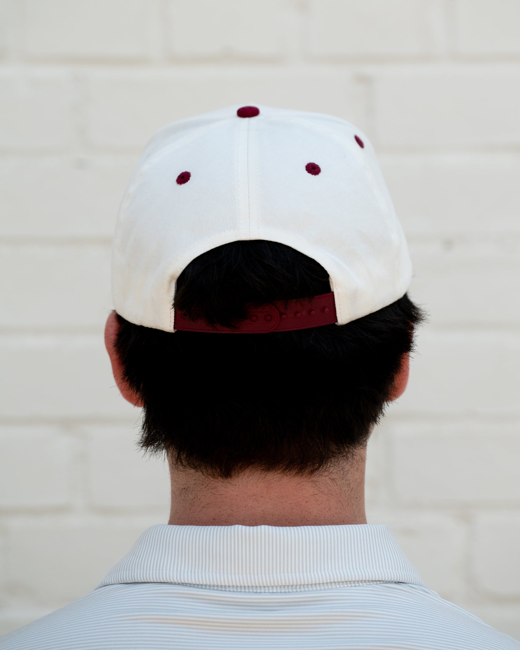 Mississippi State Cream and Maroon Hat with the Walking Bully Logo in between embroidered text “Mississippi State”