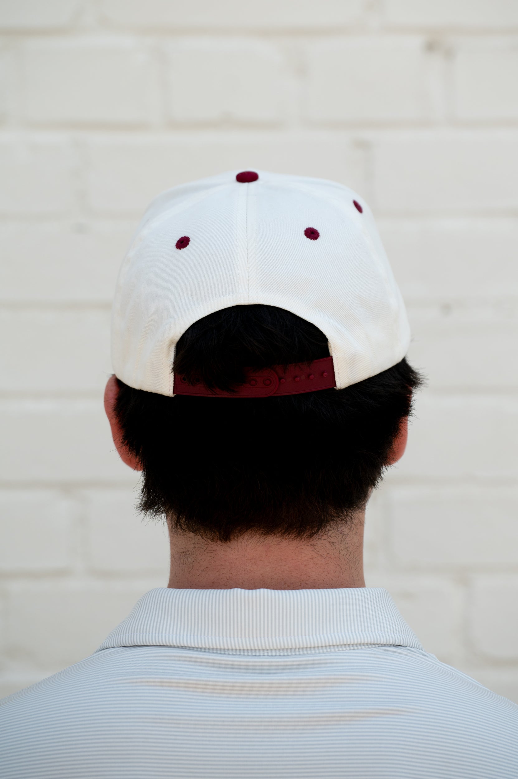 Mississippi State Cream and Maroon Hat with the Walking Bully Logo in between embroidered text “Mississippi State”