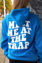 Bear Trap Blue Hoodie with 'MEET ME AT THE TRAP' printed in white text on the back.