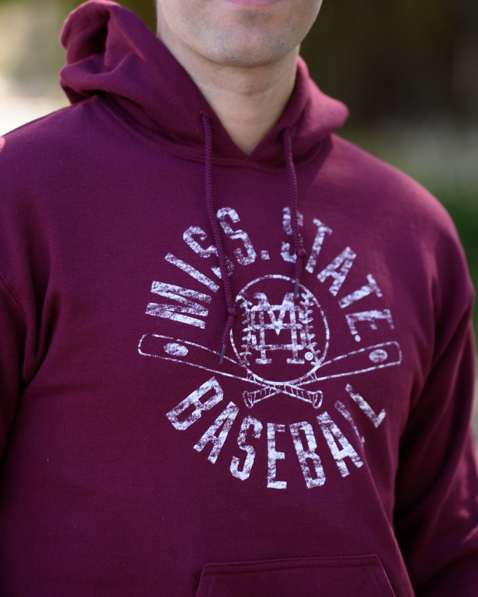Mississippi State Distressed Dark Red Hoodie with a White Baseball featuring the MS overlapping logo over crossed baseball bats, surrounded by White text “Miss. State Baseball”