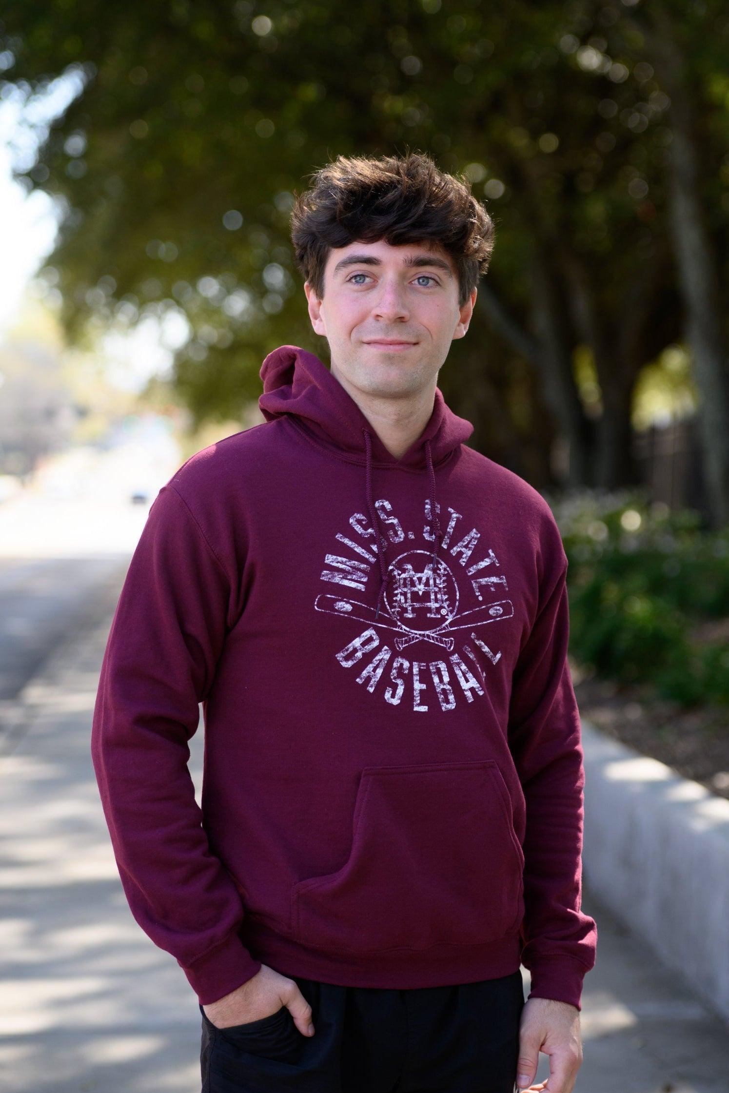 Mississippi State Distressed Dark Red Hoodie with a White Baseball featuring the MS overlapping logo over crossed baseball bats, surrounded by White text “Miss. State Baseball”