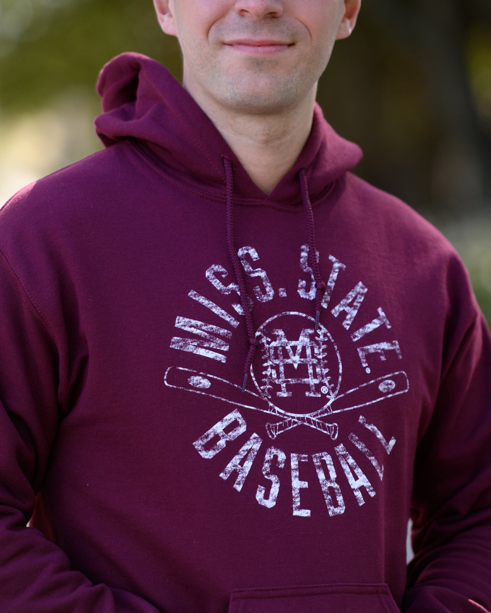 Mississippi State Distressed Dark Red Hoodie with a White Baseball featuring the MS overlapping logo over crossed baseball bats, surrounded by White text “Miss. State Baseball”