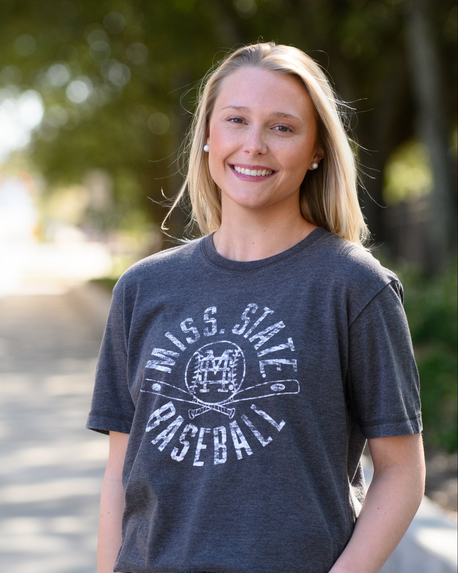Mississippi State Distressed Dark Grey T-Shirt with a White Baseball featuring the MS overlapping logo over crossed baseball bats, surrounded by White text “Miss. State Baseball”