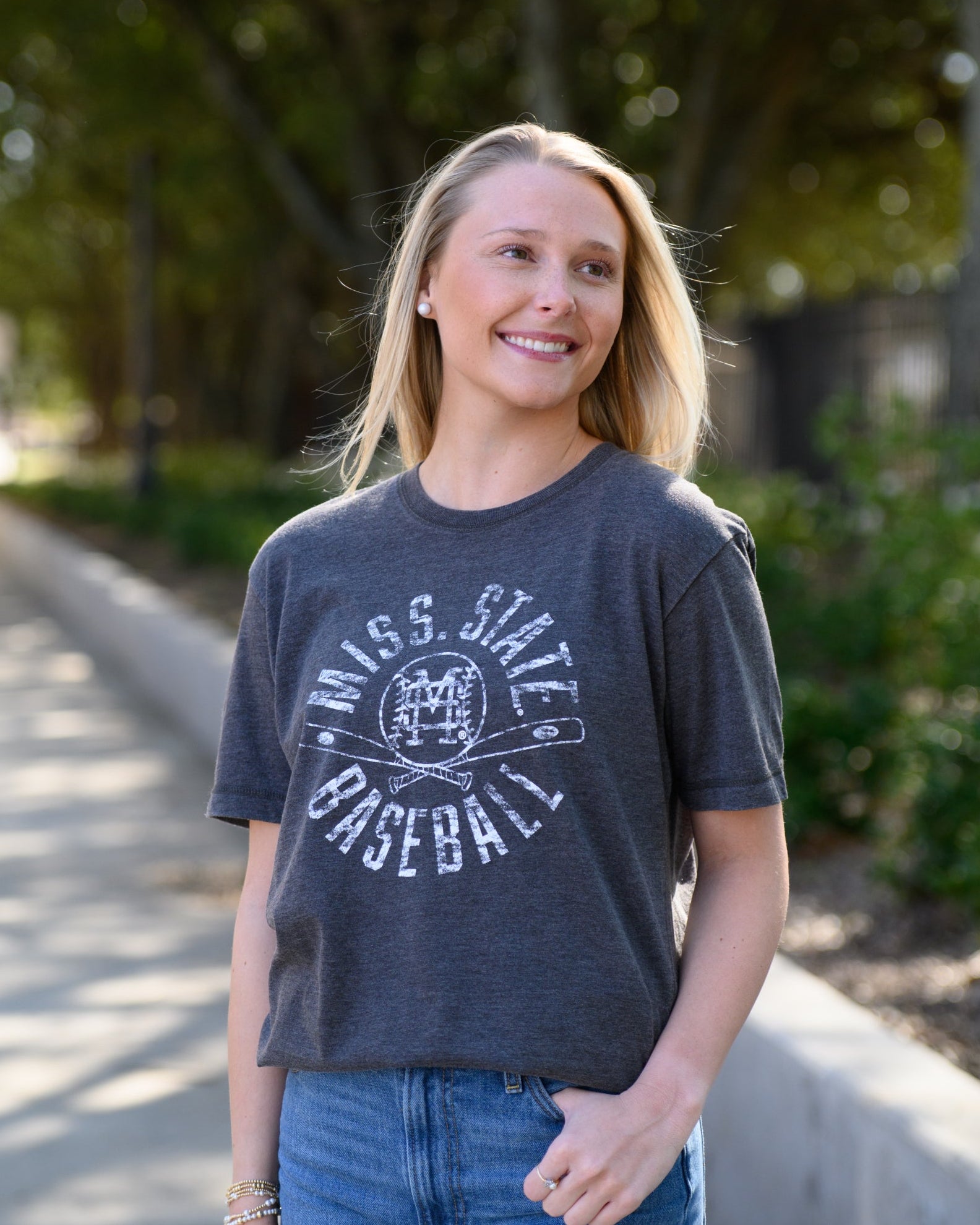 Mississippi State Distressed Dark Grey T-Shirt with a White Baseball featuring the MS overlapping logo over crossed baseball bats, surrounded by White text “Miss. State Baseball”