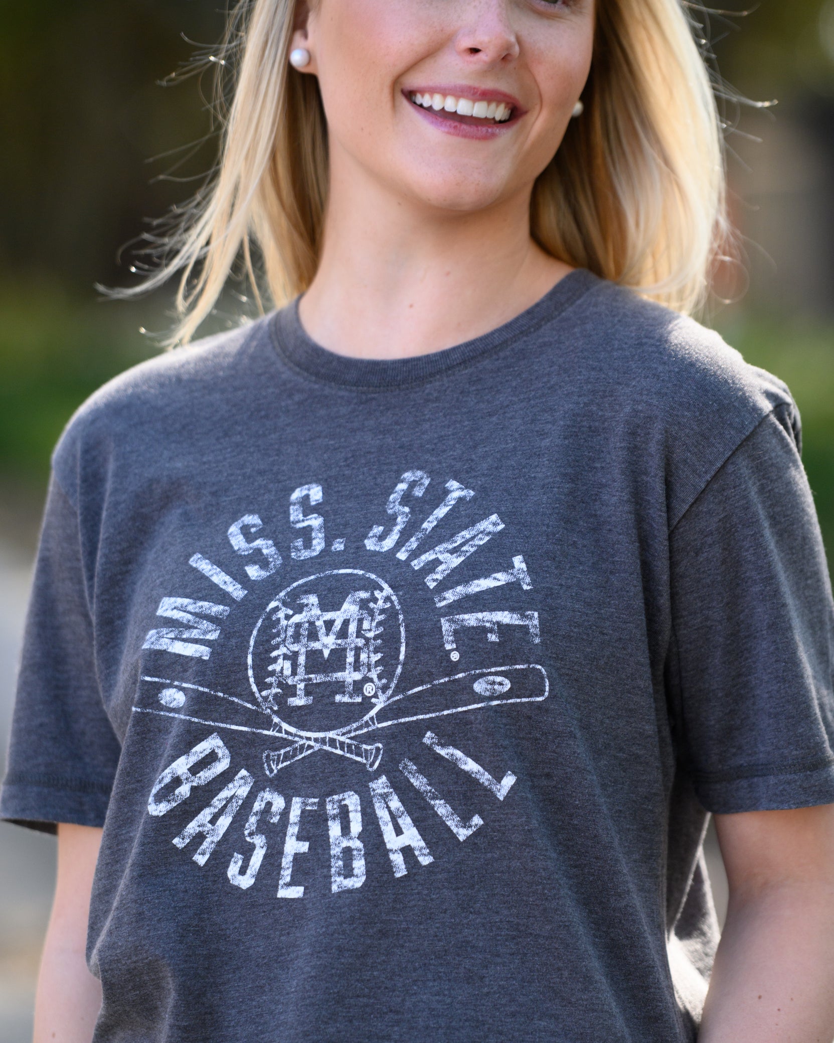 Mississippi State Distressed Dark Grey T-Shirt with a White Baseball featuring the MS overlapping logo over crossed baseball bats, surrounded by White text “Miss. State Baseball”
