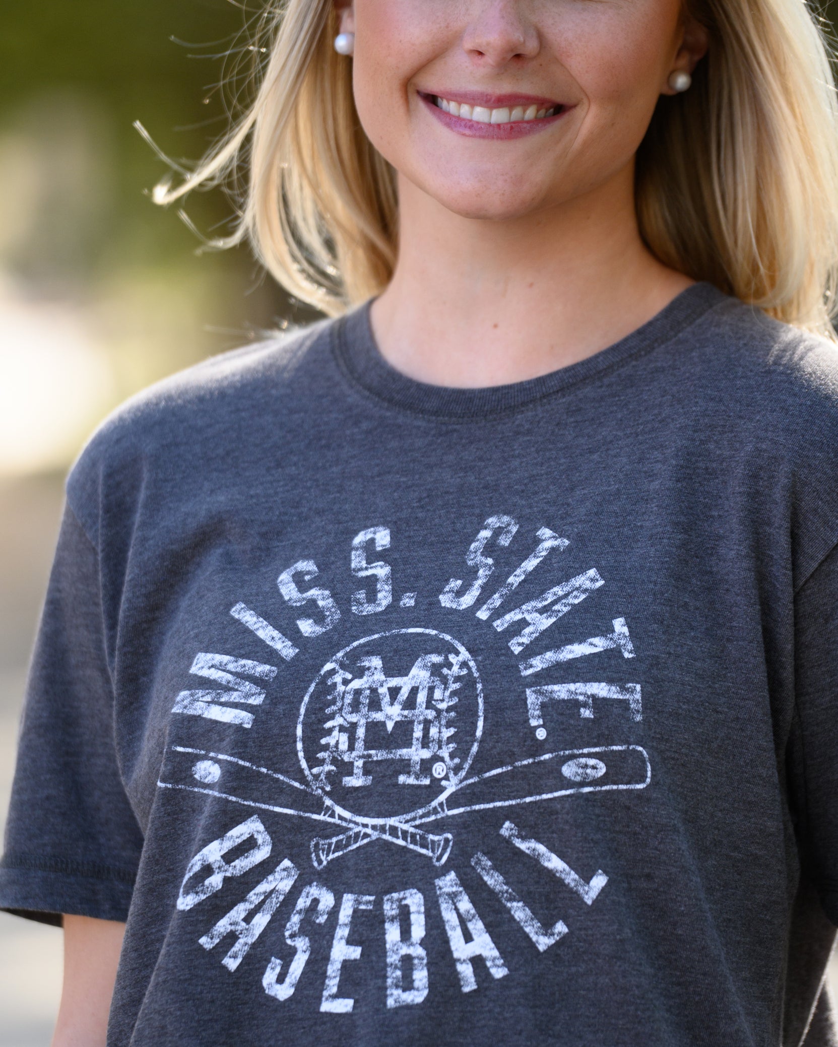 Mississippi State Distressed Dark Grey T-Shirt with a White Baseball featuring the MS overlapping logo over crossed baseball bats, surrounded by White text “Miss. State Baseball”