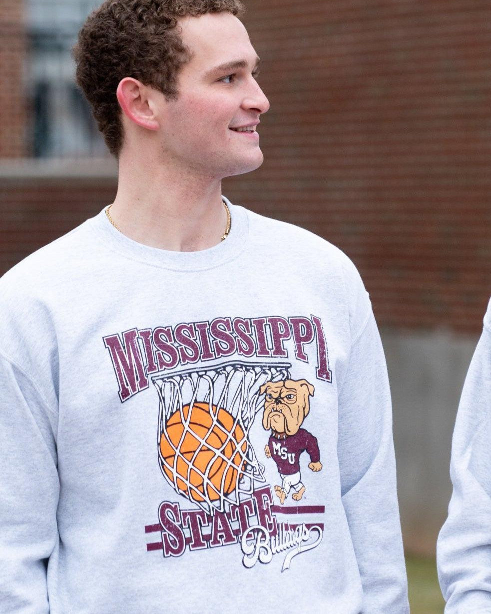 Mississippi State Light Grey Heather Sweatshirt with a basketball landing in a hoop between text “Mississippi” and “State” and next to Bully