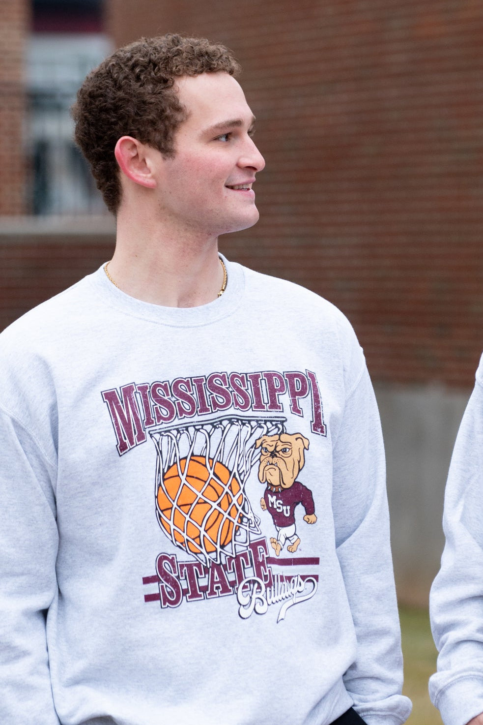 Mississippi State Light Grey Heather Sweatshirt with a basketball landing in a hoop between text “Mississippi” and “State” and next to Bully
