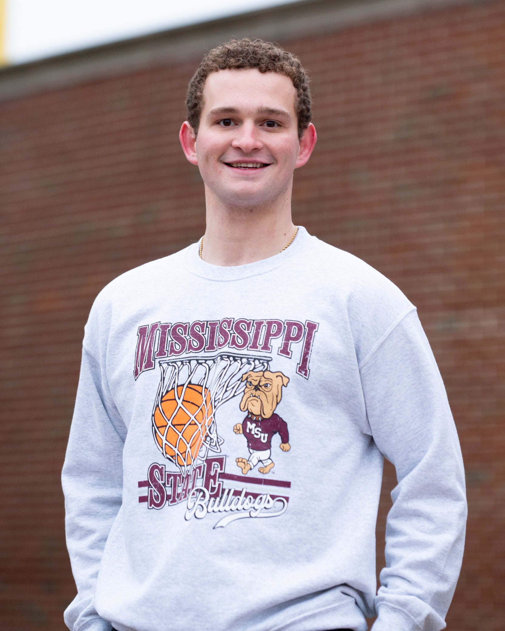 Mississippi State Light Grey Heather Sweatshirt with a basketball landing in a hoop between text “Mississippi” and “State” and next to Bully
