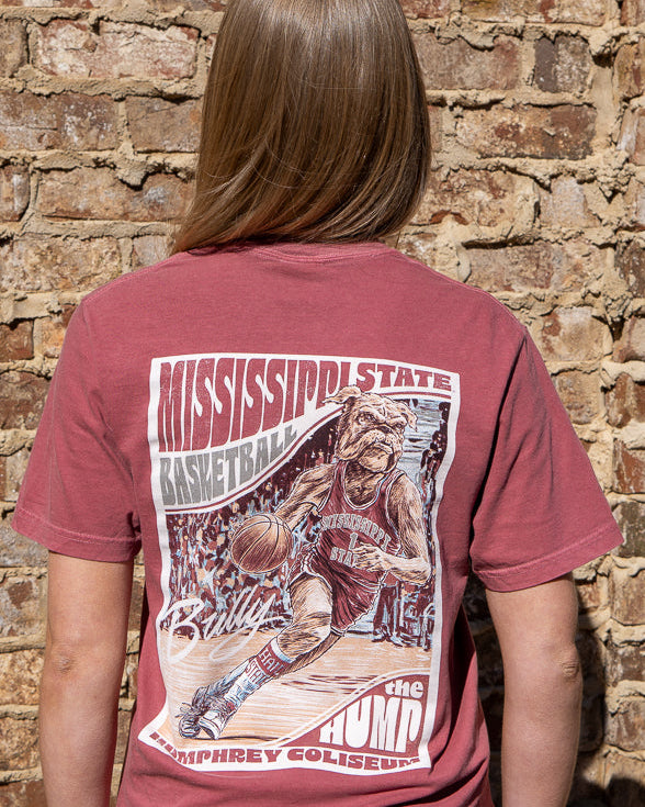 Mississippi State Crimson T-Shirt with a basketball card style design featuring Bully dribbling a basketball down the court in between text “Mississippi State Basketball” and “The Hump Humphrey Coliseum”