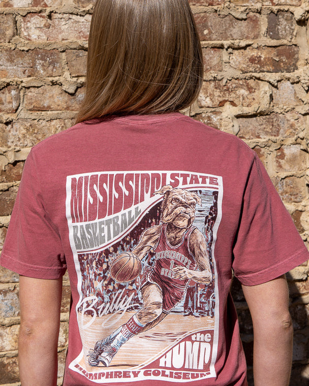 Mississippi State Crimson T-Shirt with a basketball card style design featuring Bully dribbling a basketball down the court in between text “Mississippi State Basketball” and “The Hump Humphrey Coliseum”