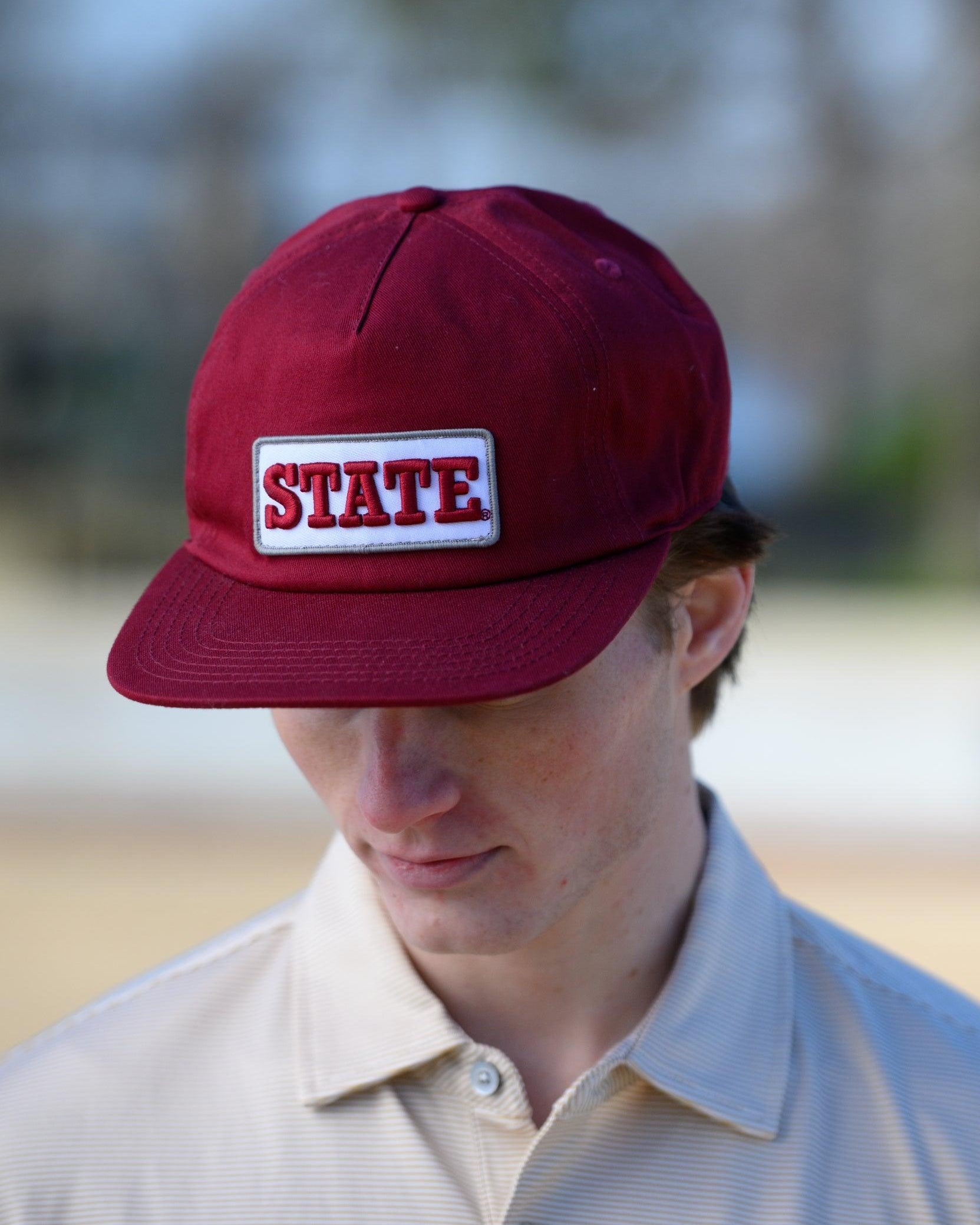 Mississippi State Maroon Snapback Hat featuring a White patch with Maroon “State” embroidery