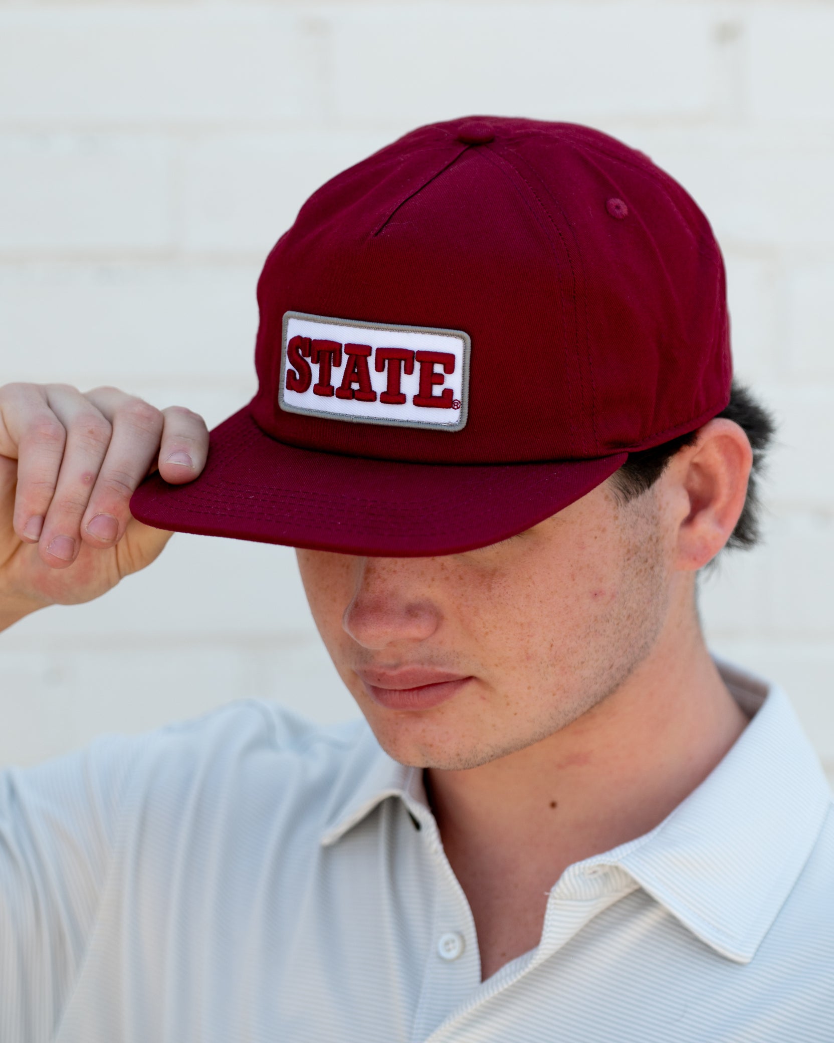 Mississippi State Maroon Snapback Hat featuring a White patch with Maroon “State” embroidery