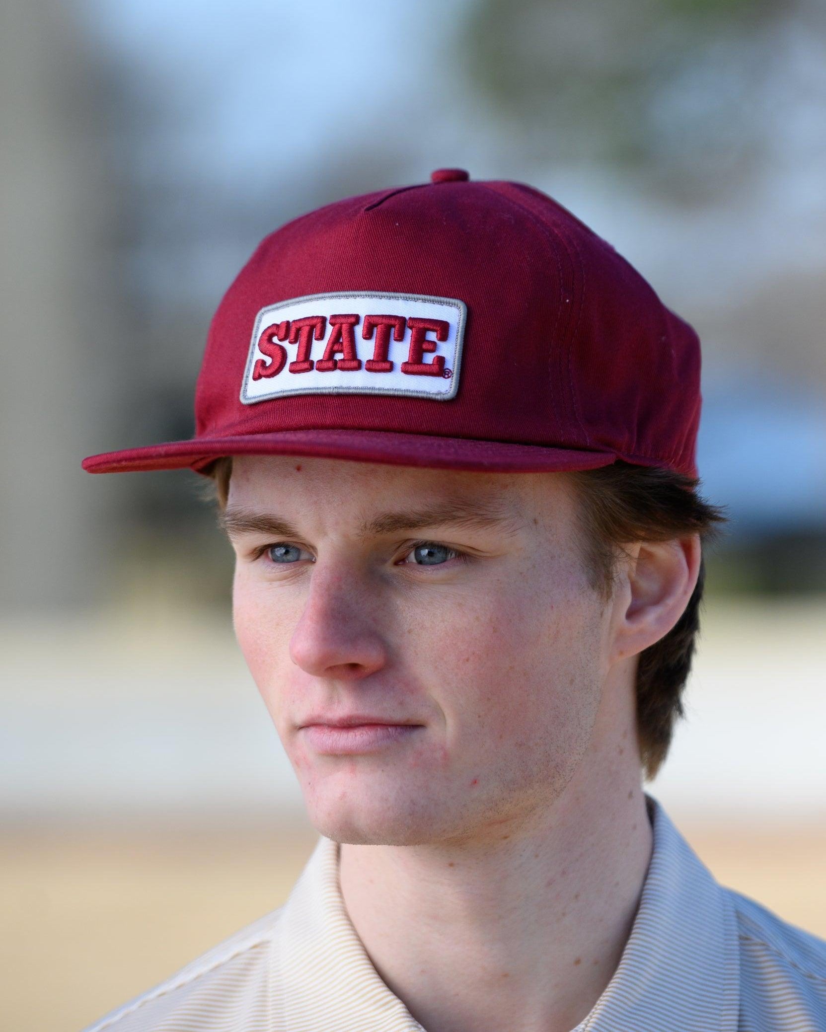 Mississippi State Maroon Snapback Hat featuring a White patch with Maroon “State” embroidery