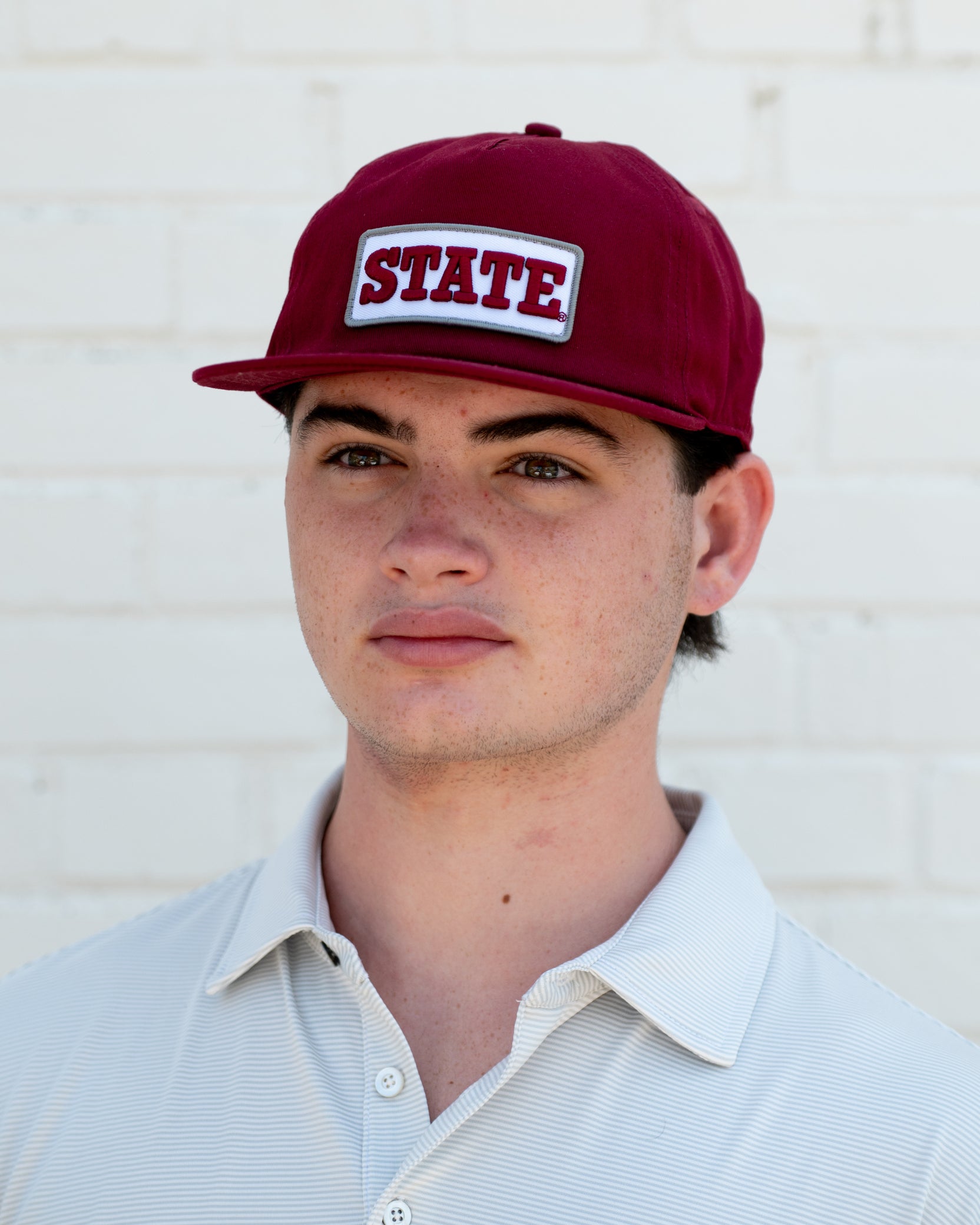 Mississippi State Maroon Snapback Hat featuring a White patch with Maroon “State” embroidery