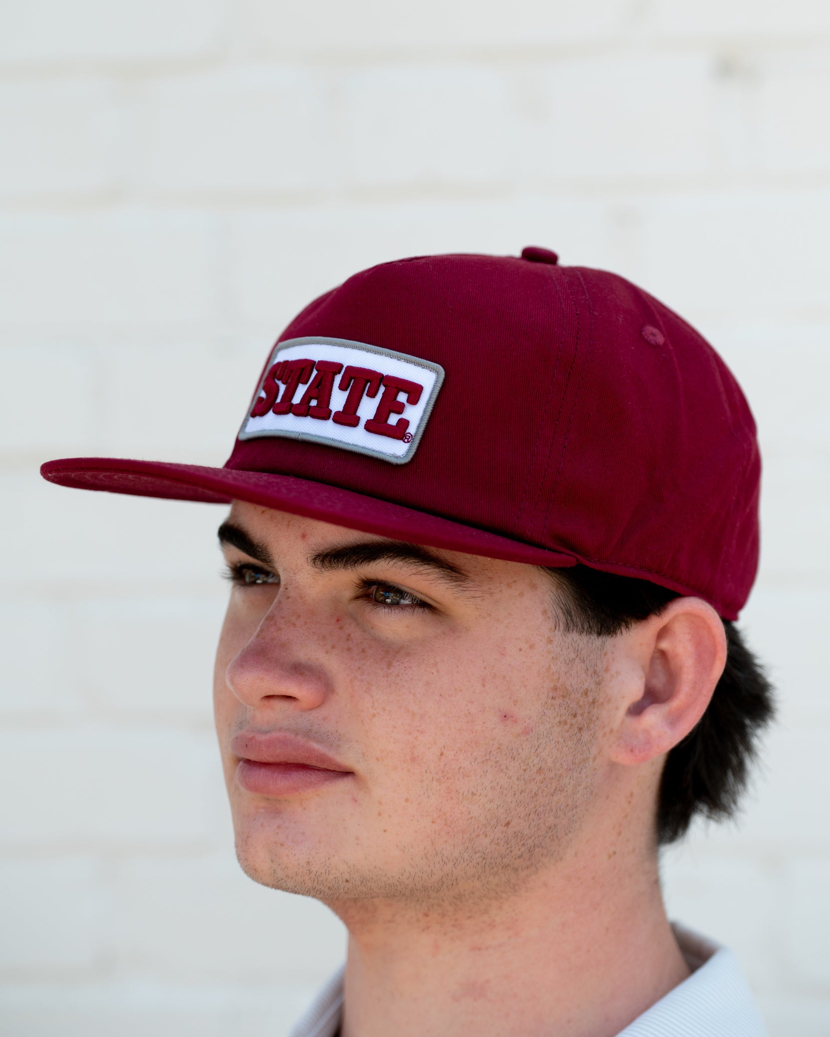 Mississippi State Maroon Snapback Hat featuring a White patch with Maroon “State” embroidery