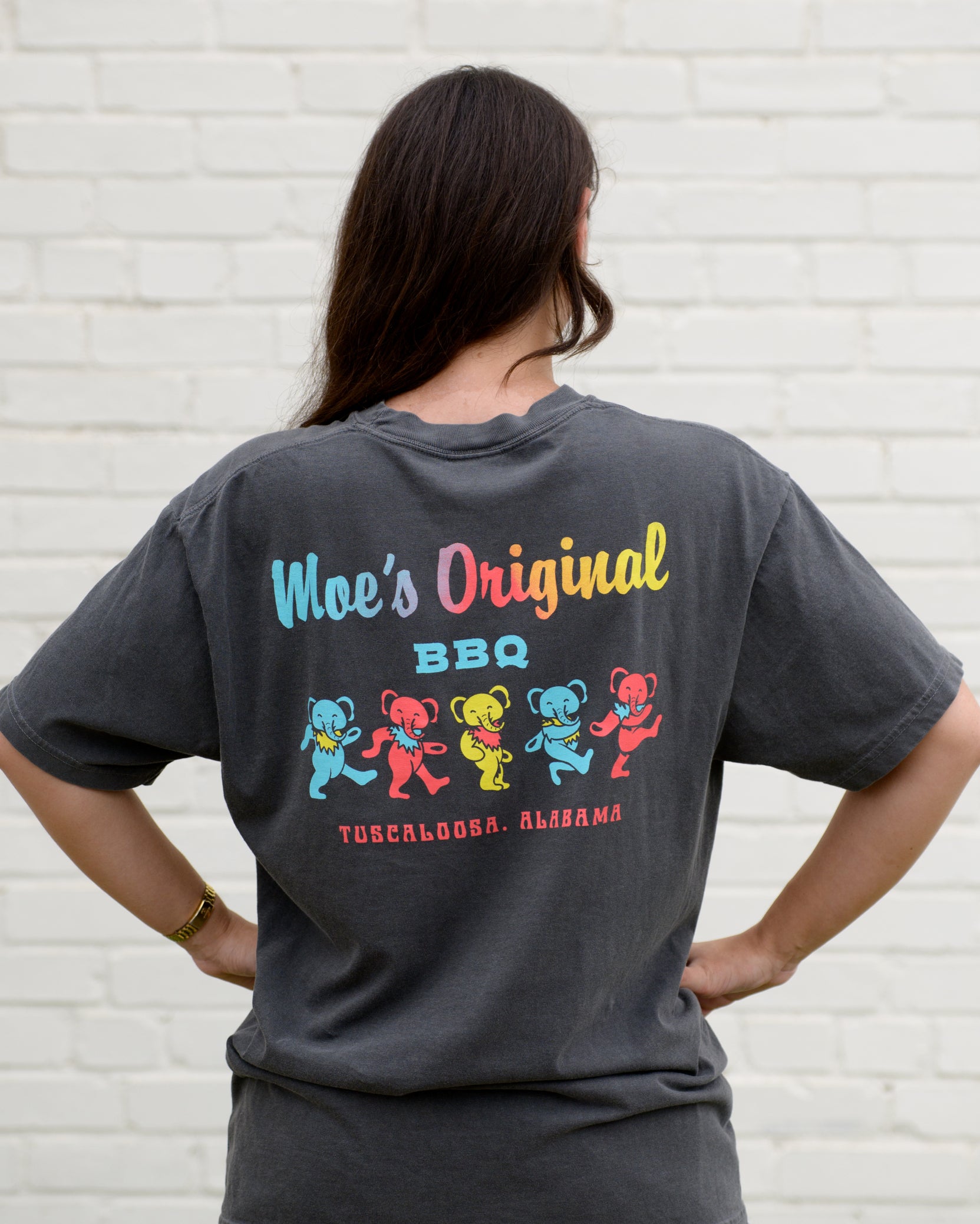 Moe's Grey Grateful Elephant T-Shirt with text "Moe's Original BBQ" above five dancing elephants