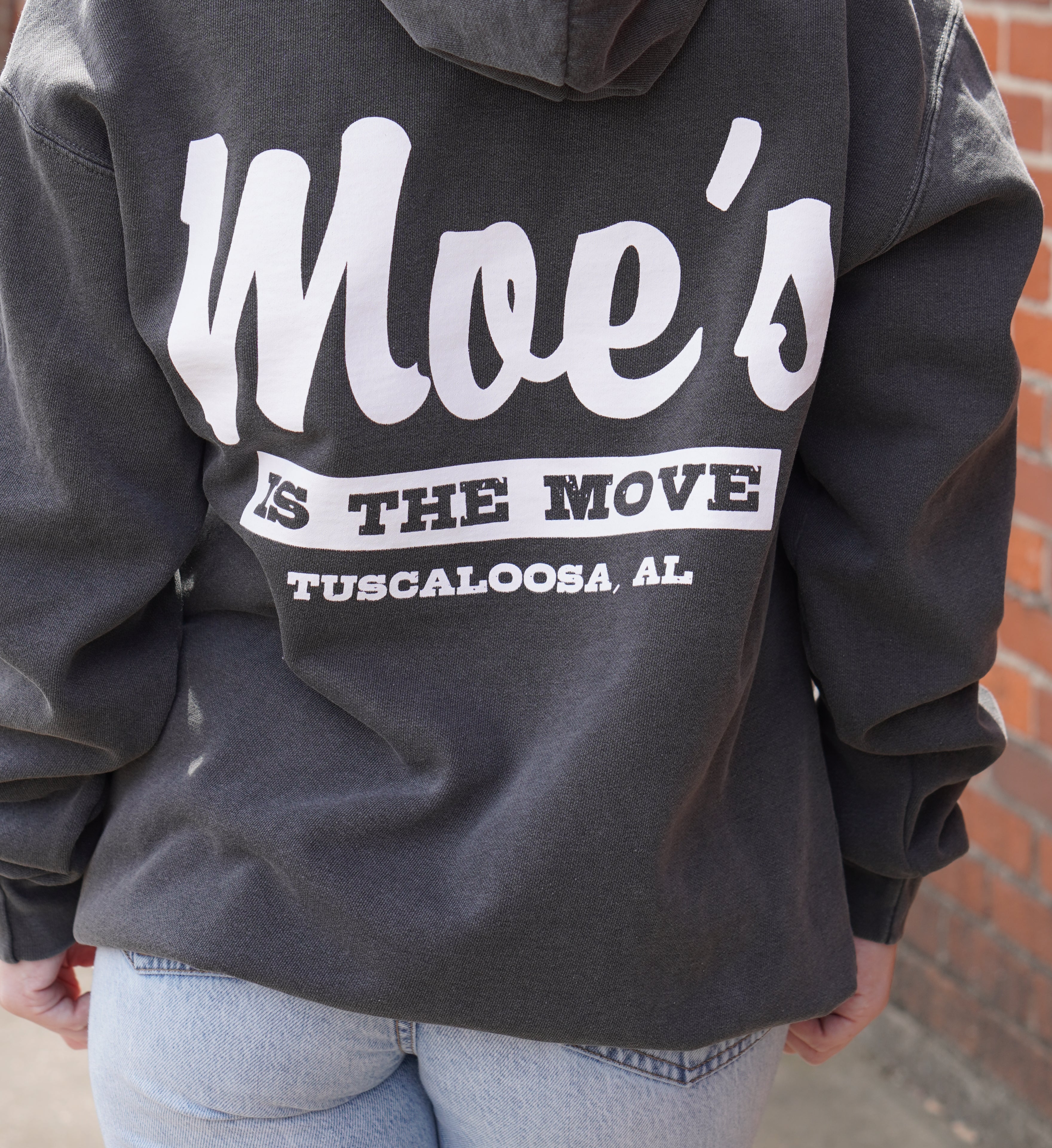 Moe's Grey Hoodie with White text "Moe's IS THE Move" printed on the back