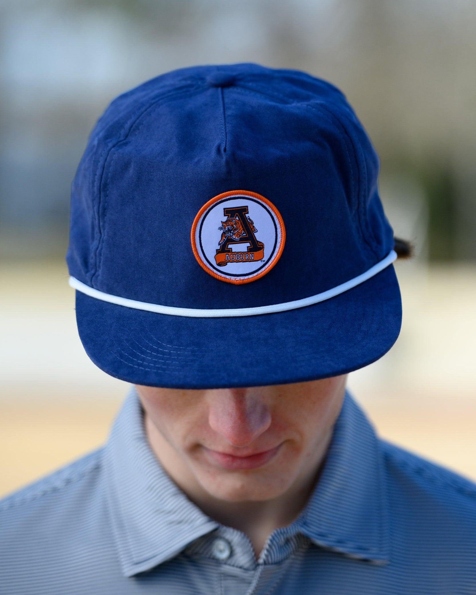 Auburn University Navy Hat with a White rope and a patch of the Leaping Tiger Logo