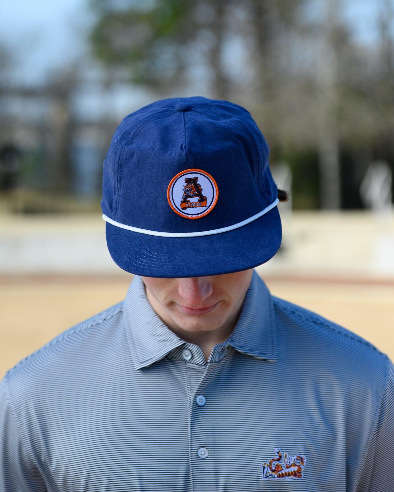 Auburn University Navy Hat with a White rope and a patch of the Leaping Tiger Logo