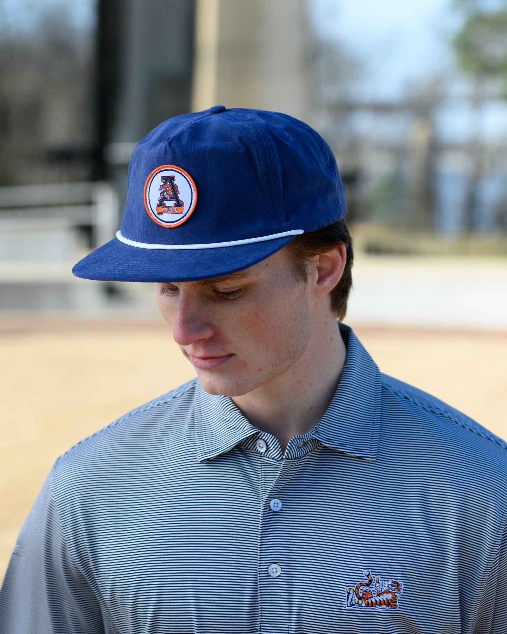 Auburn University Navy Hat with a White rope and a patch of the Leaping Tiger Logo