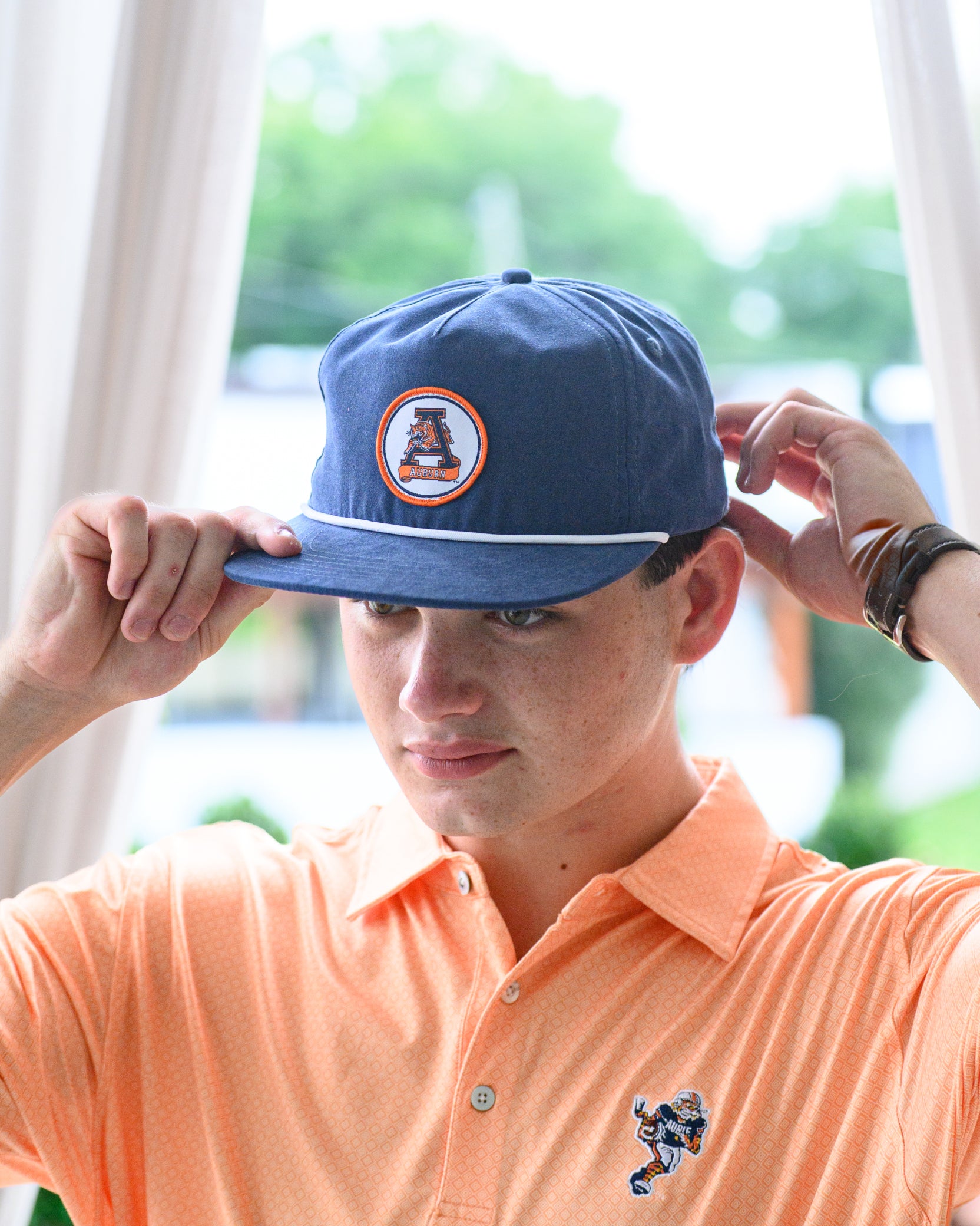 Auburn University Navy Hat with a White rope and a patch of the Leaping Tiger Logo